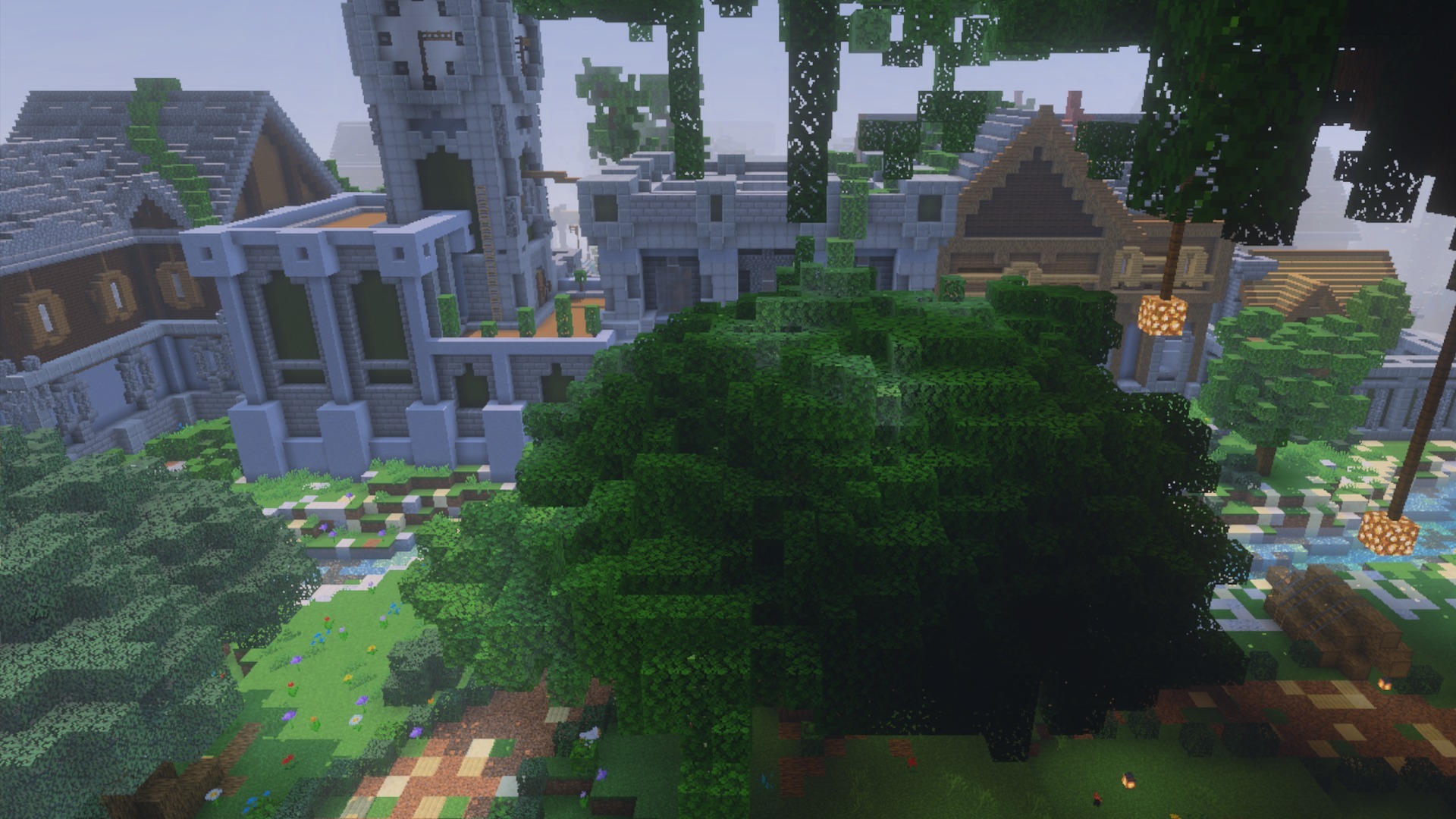 Classic Panorama with Shaders Texture Pack showing a village with a clock tower