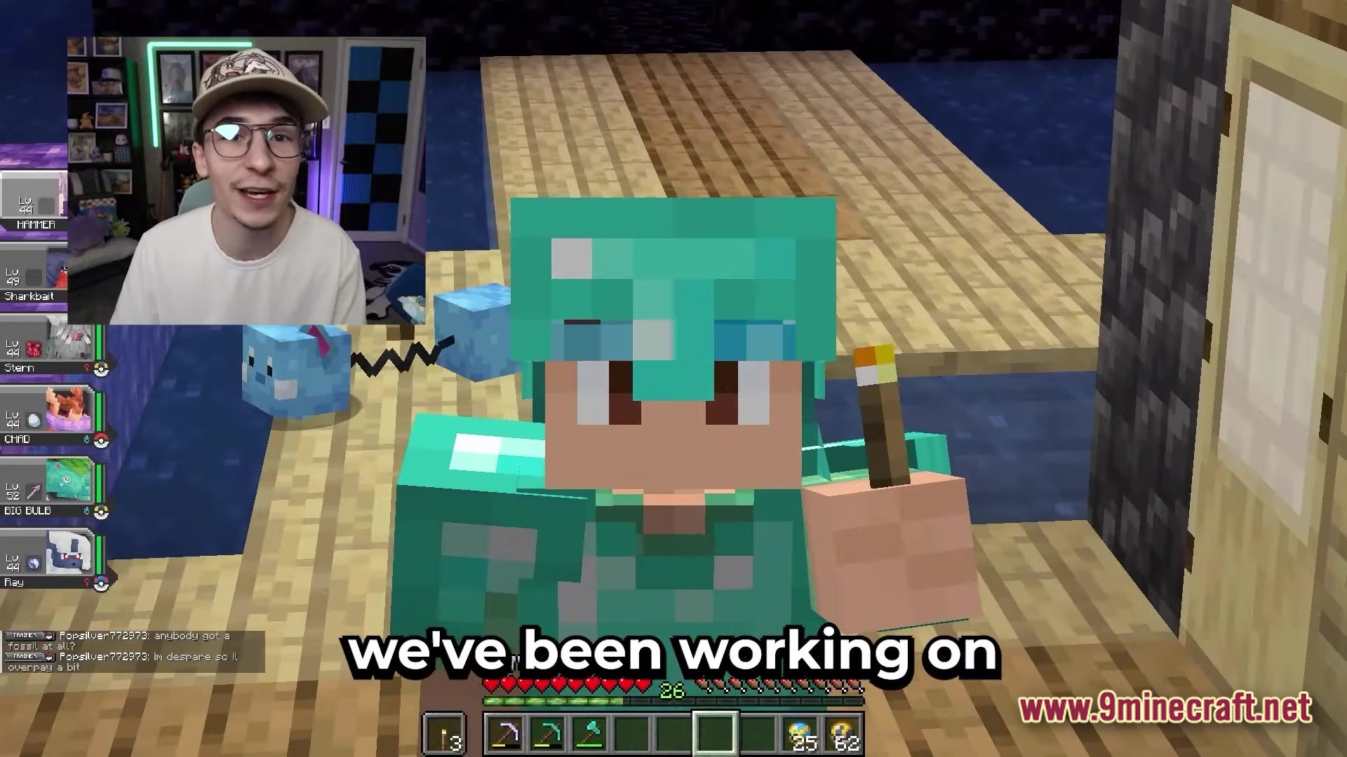 Cobblemon Brasil Modpack Screenshot 1 A player in diamond armor stands on a wooden platform next to a blue Azurill