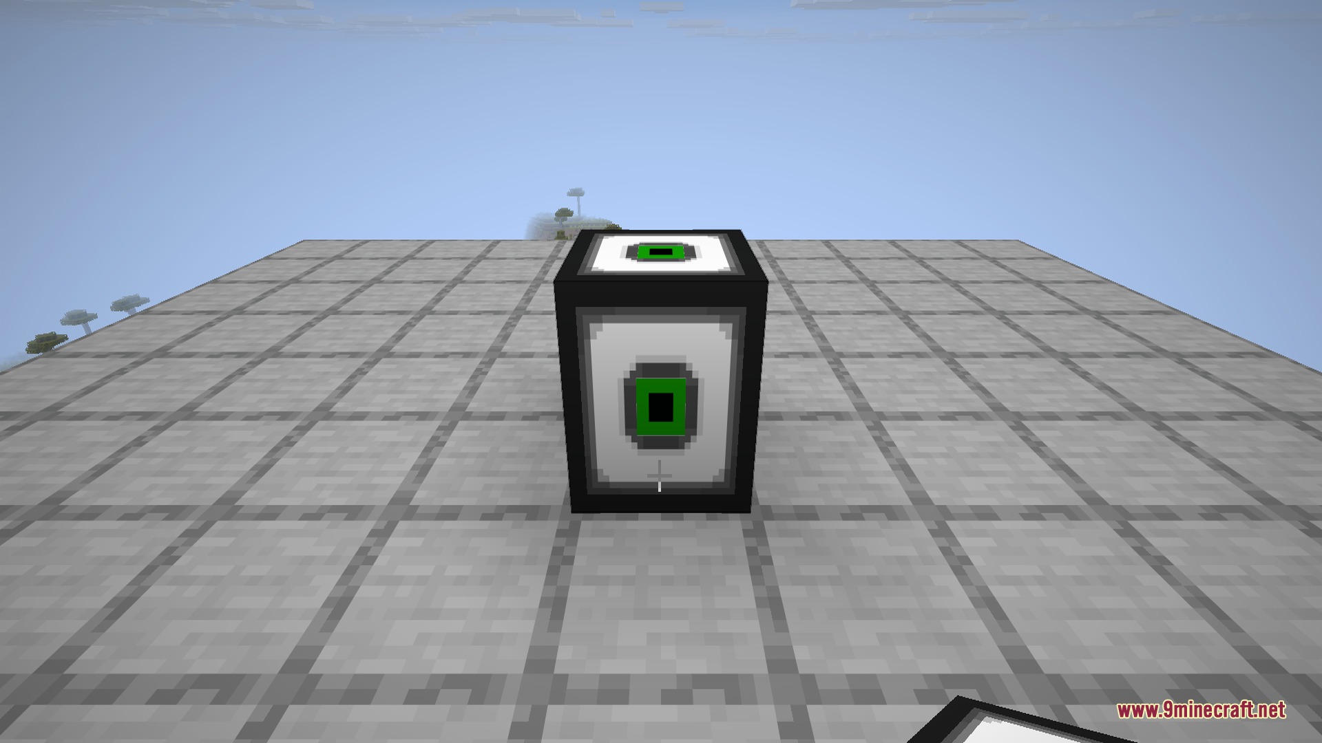 A Compact Machine block placed in the world - its black-and-white casing with a green core is the entrance to a whole room hidden inside.