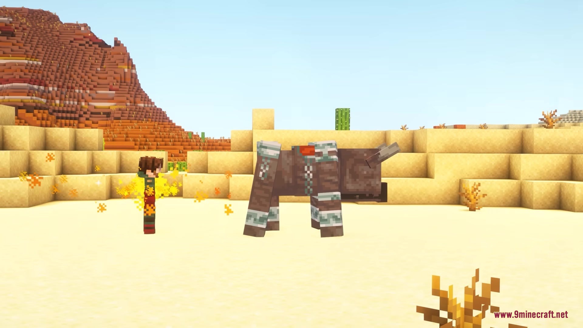 A player with yellow particles standing next to a large brown creature