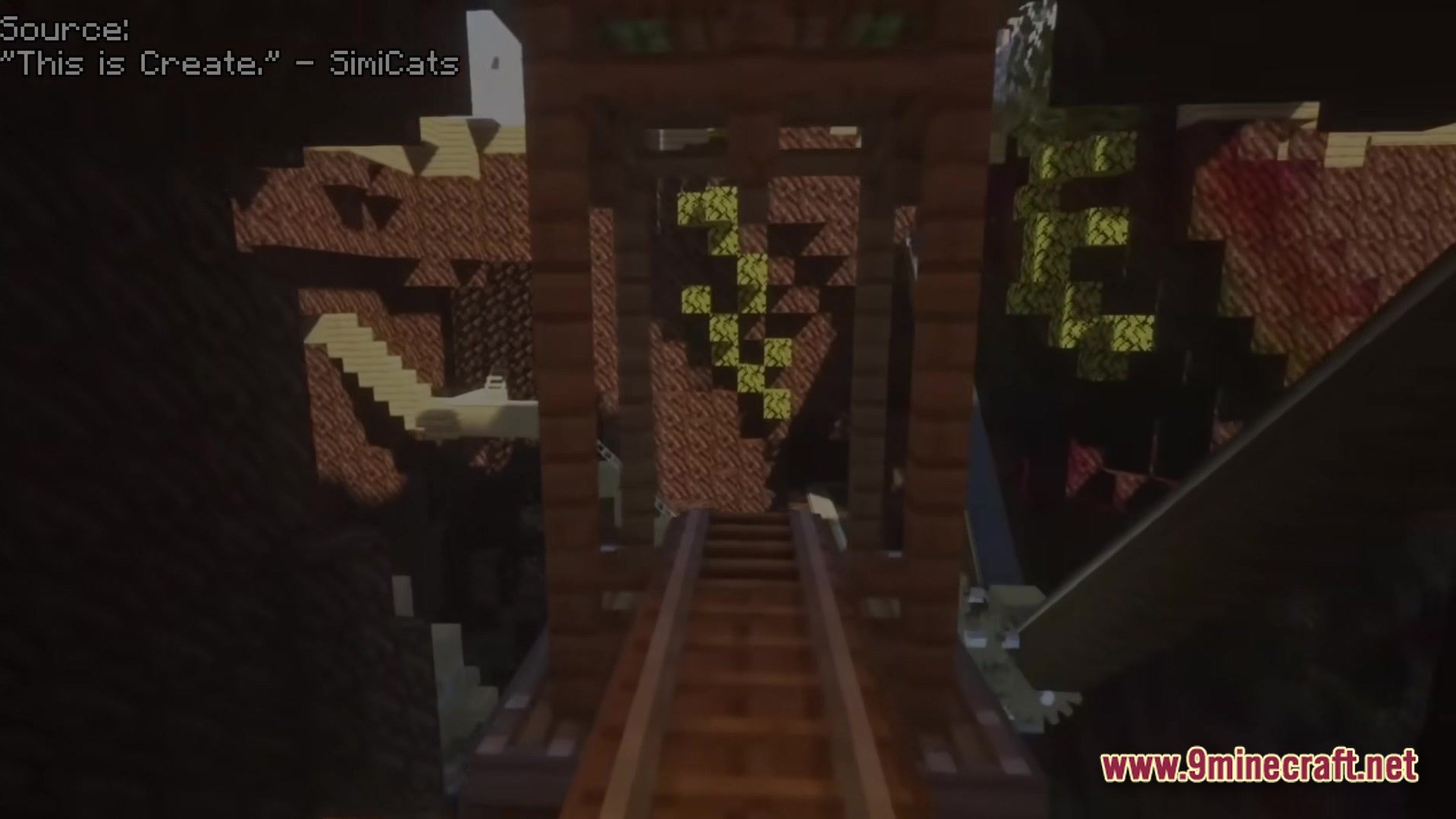 Create Modpack Screenshot 3 A wooden train track bridge spans across a dark, cavernous underground environment with rocky walls