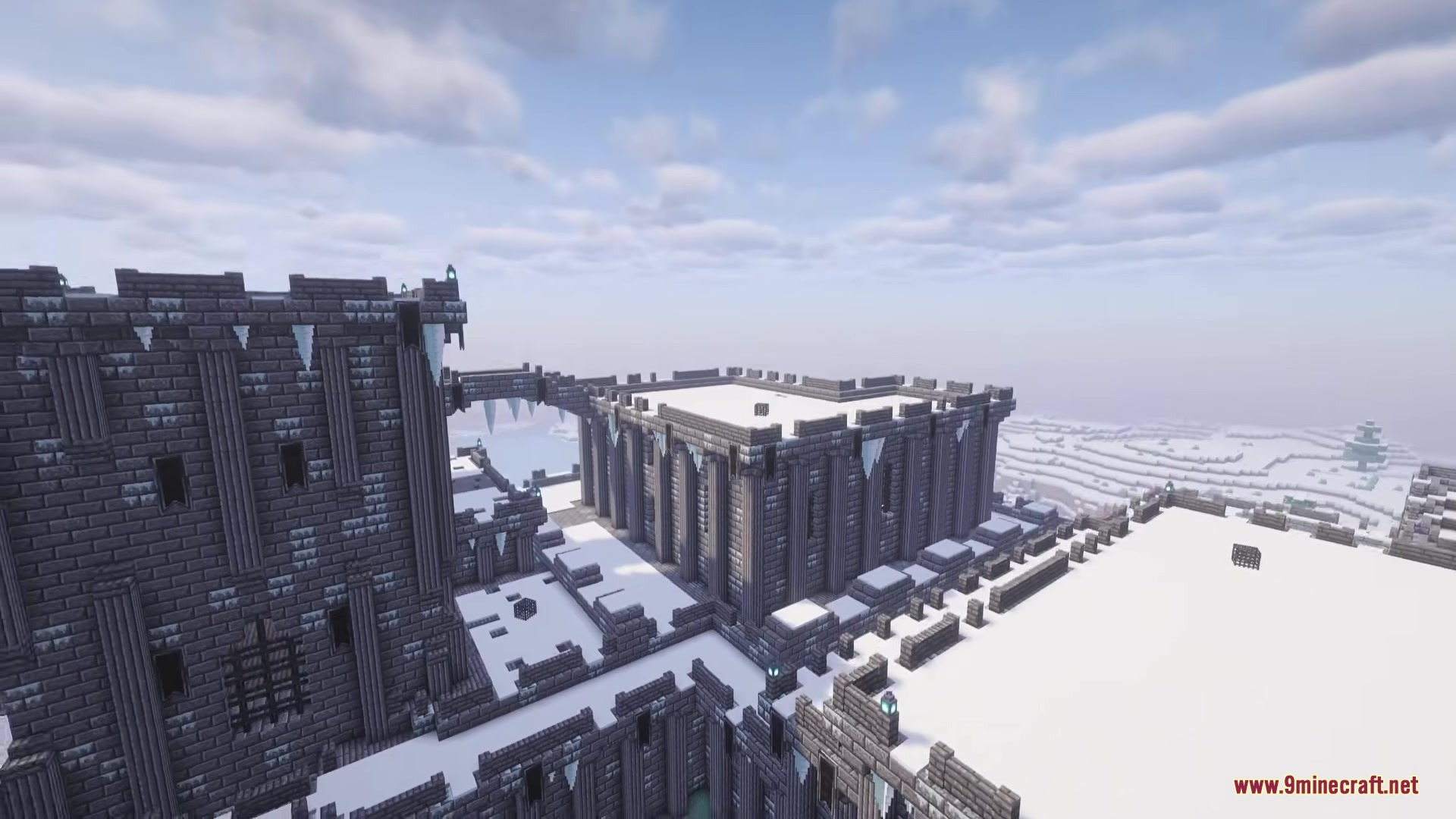 Cursed Relics Dungeons Mod Screenshot 8 Snowy stone fortress with battlements and icicles under cloudy sky