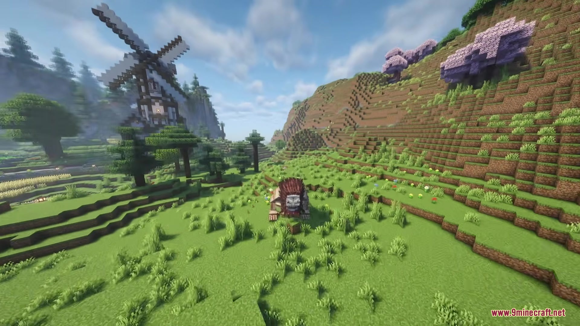 Danny's AOT Mod Screenshot 13 A Jaw Titan stands in a grassy field near a large windmill