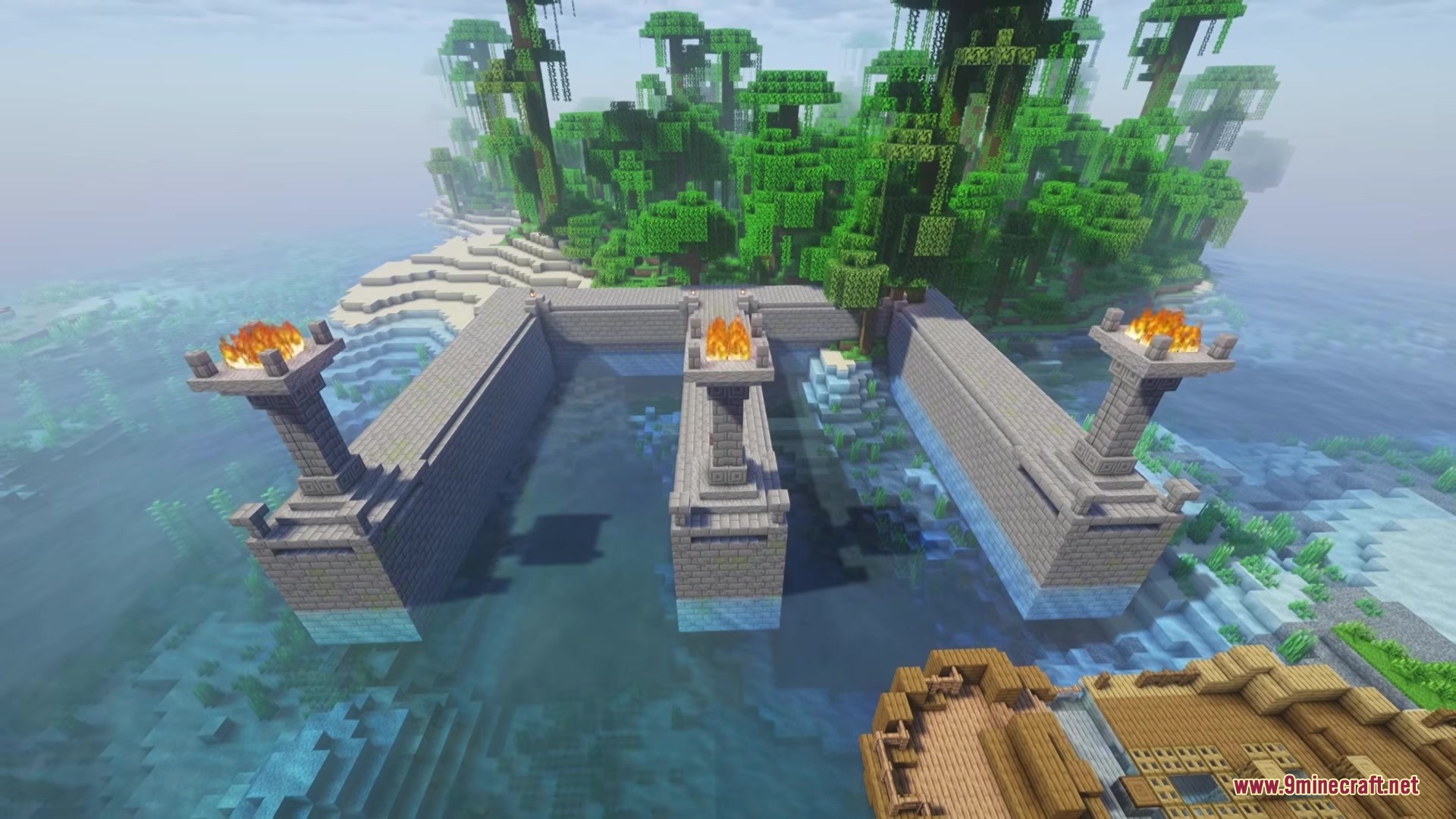 Danny's AOT Mod Screenshot 6 A stone dock structure with flaming torches built near a lush jungle biome