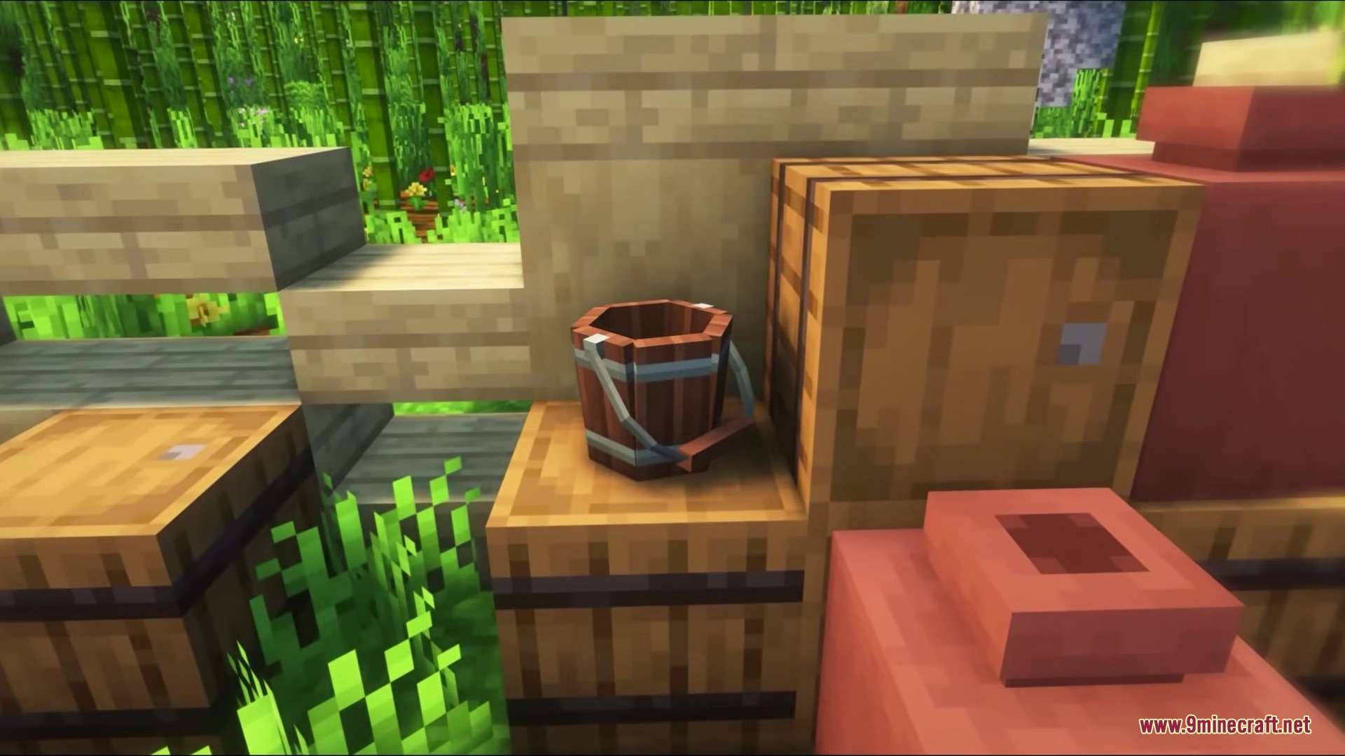 A small wooden bucket placed on a barrel in a bamboo forest