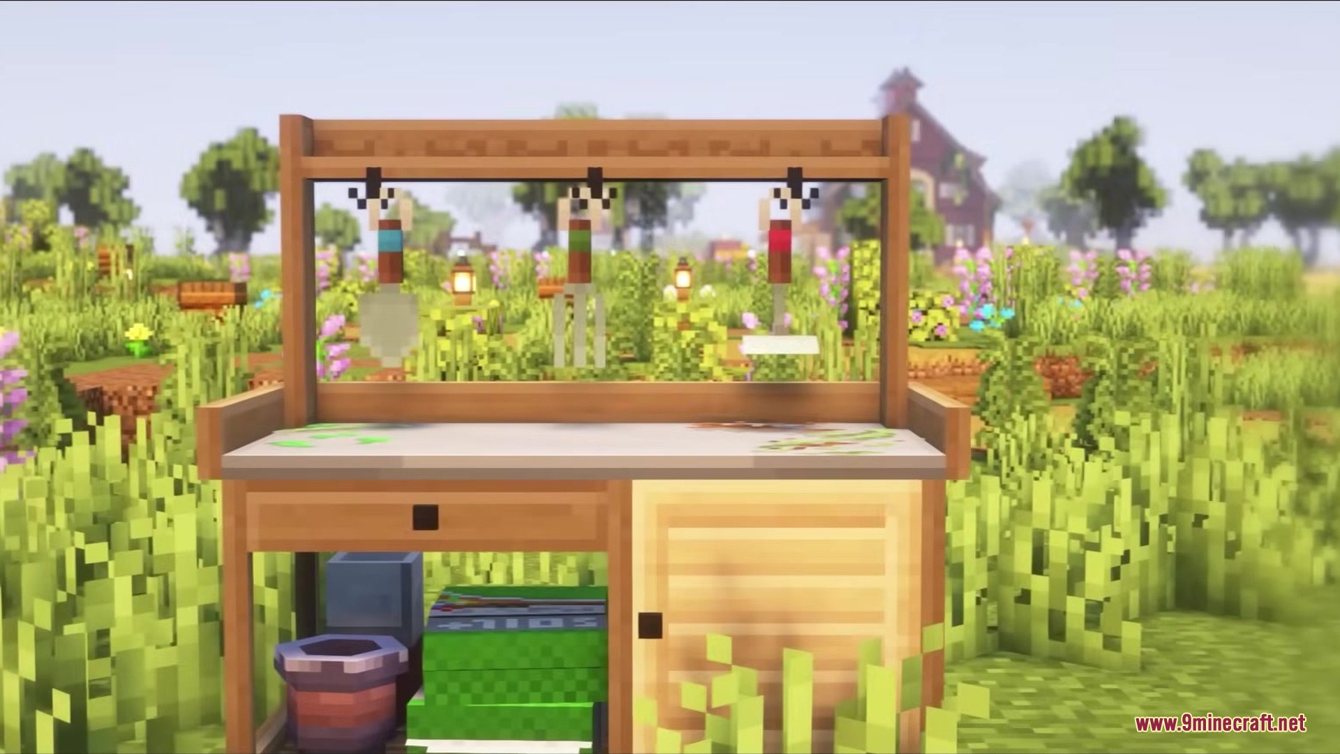 A wooden nature bench with gardening tools in a flowery field