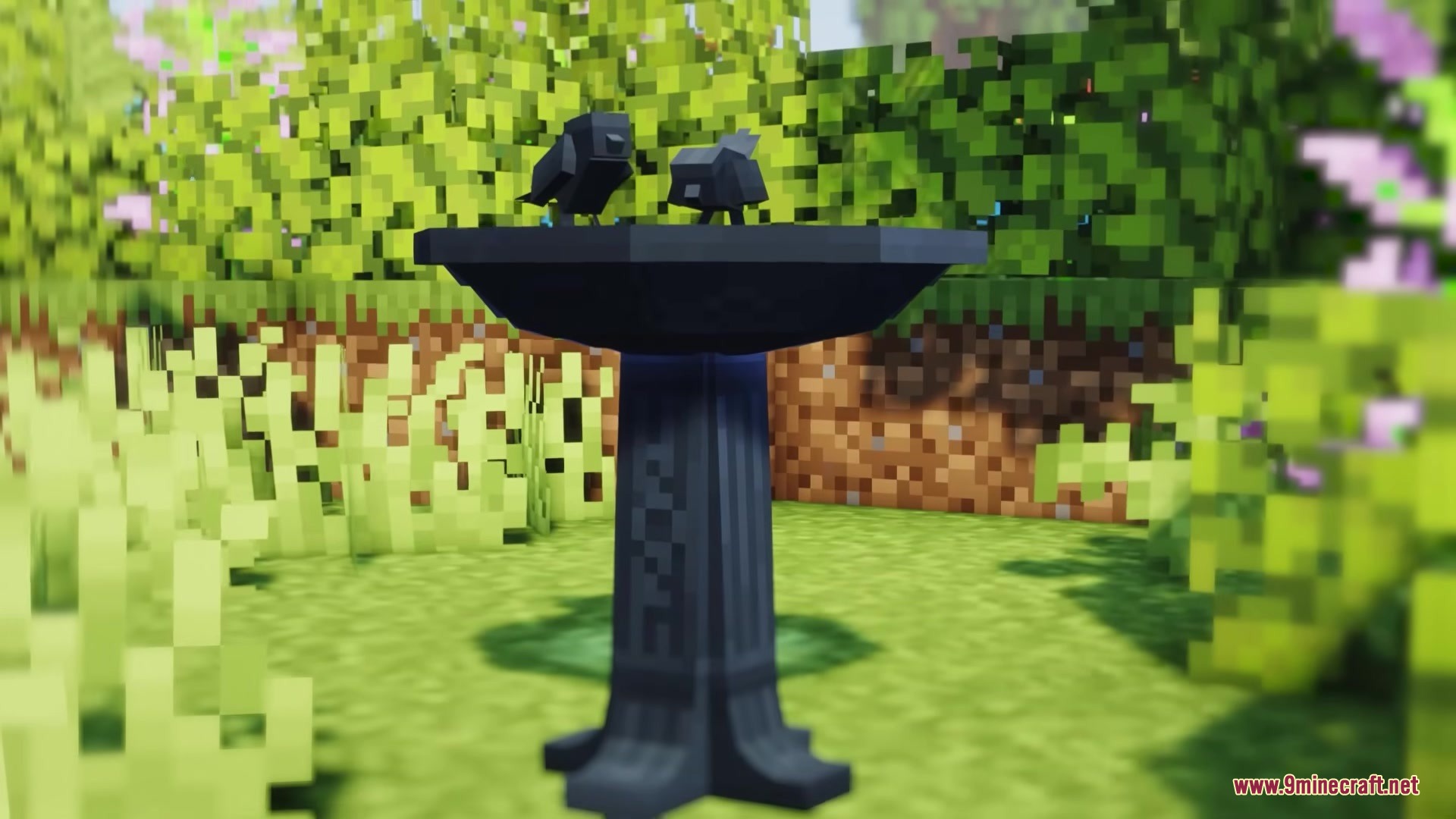Two small birds perched on a dark birdbath from the Deconature Mod