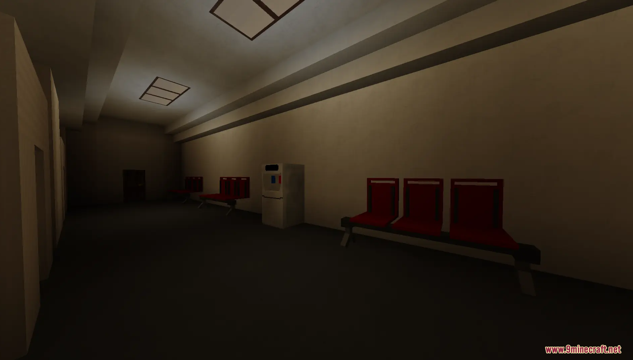 Descend Map Screenshot 2 Red chairs and a vending machine line a dark corridor in the building