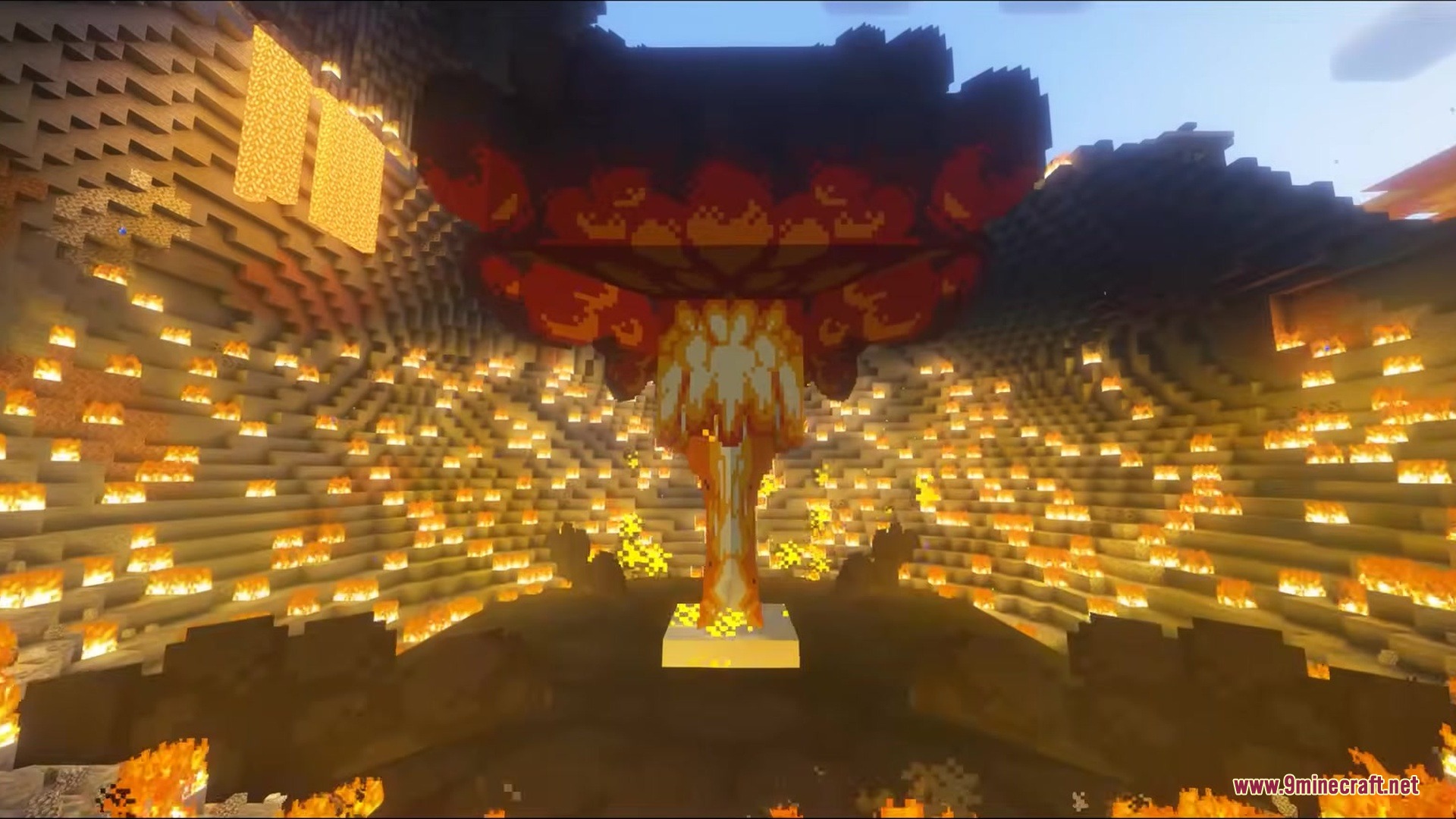A massive mushroom cloud explosion erupting inside a large fiery crater