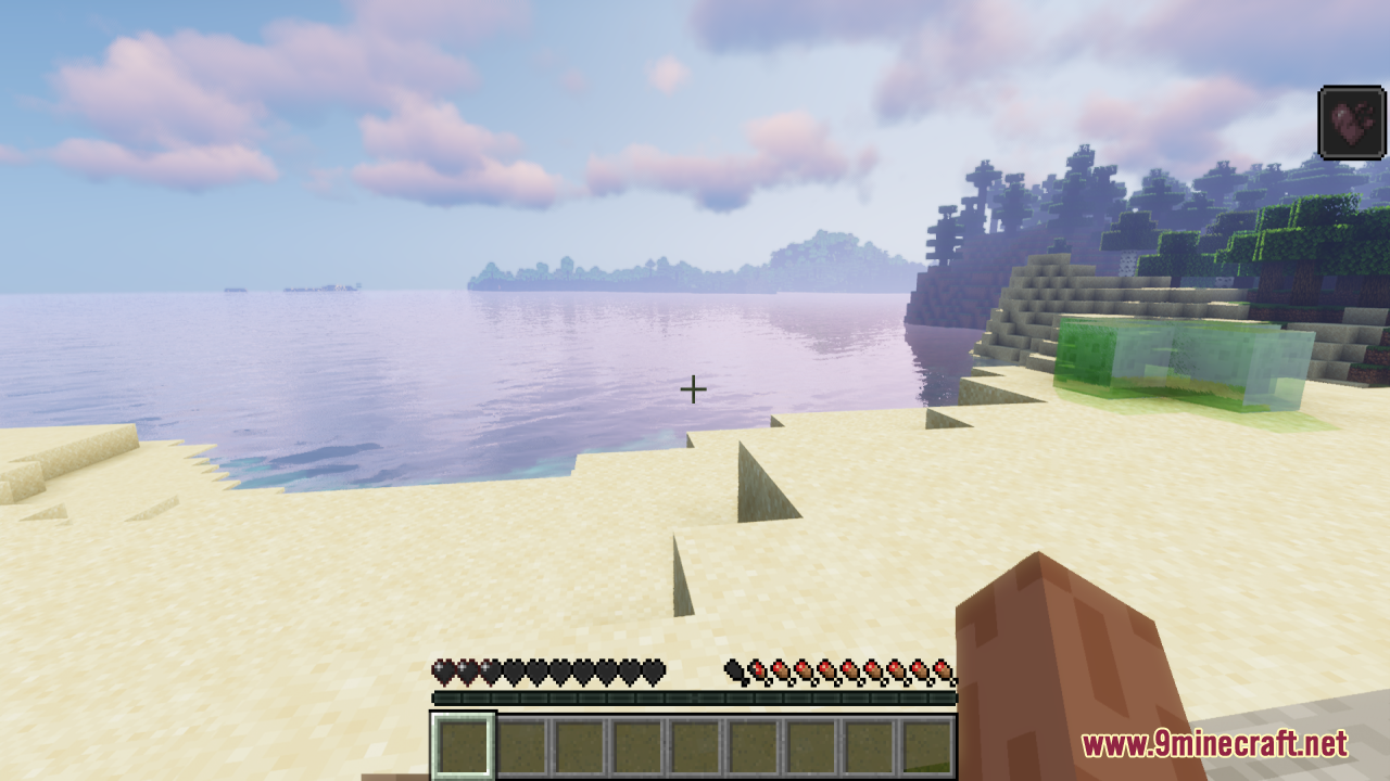 The health bar displays black heart icons while a slime sits on the beach