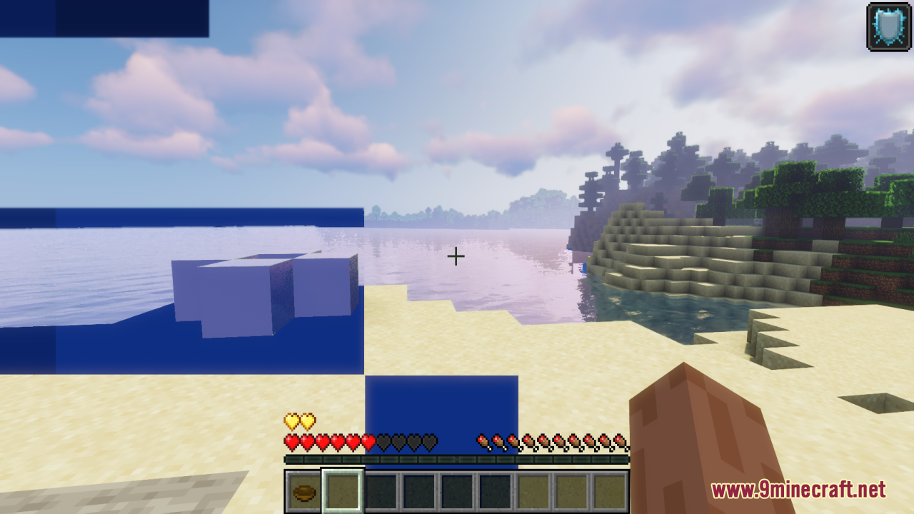 Minecraft beach scene showing updated health bar icons with red and yellow heart designs