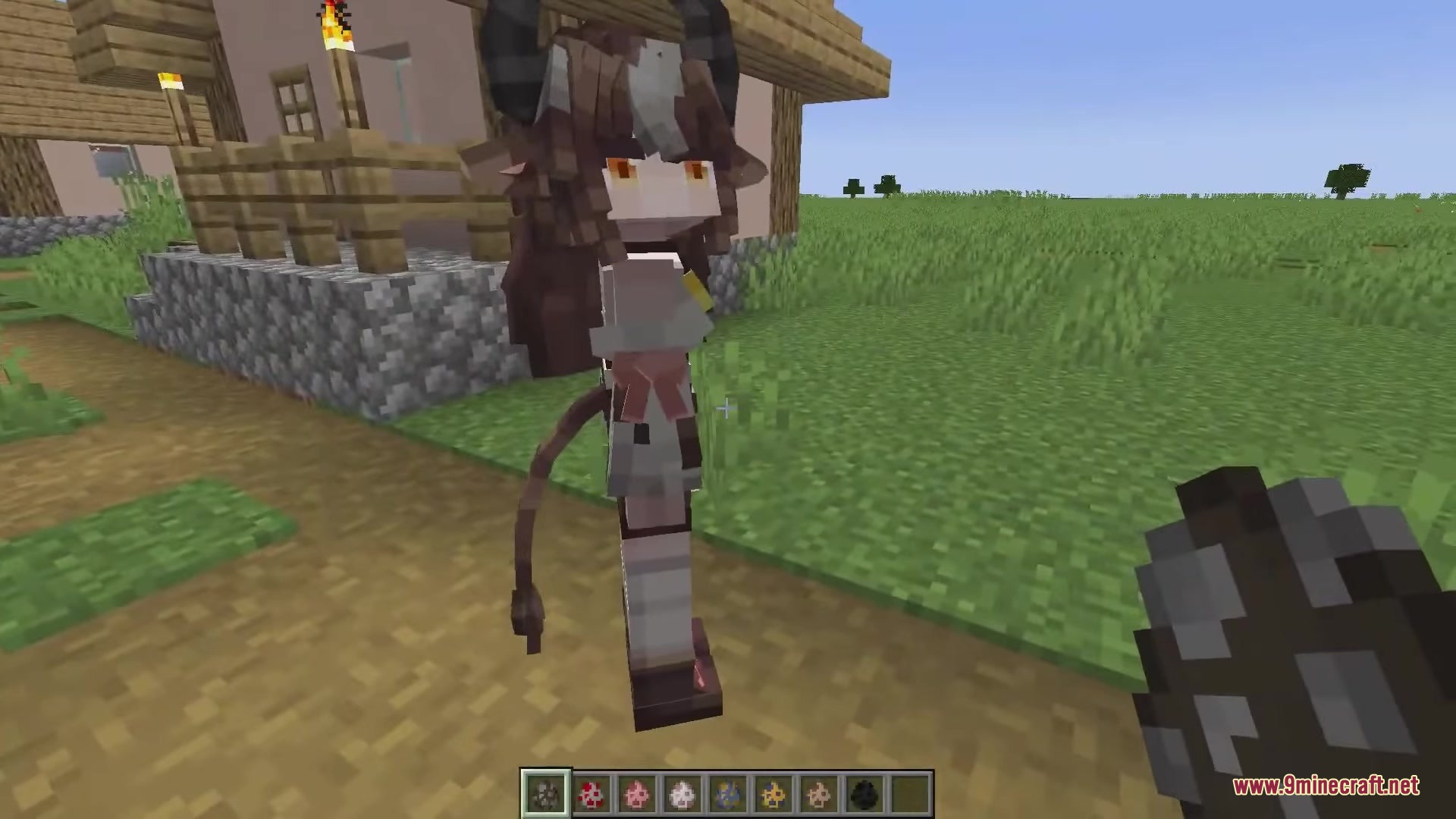 Dokimobs Mod Screenshot 1 Dokimobs Mod cow girl with horns stands near a village house