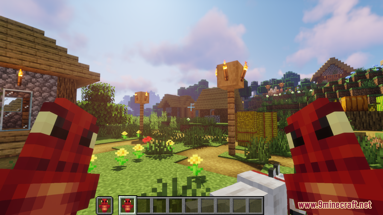 Dragon Totem of Undying Resource Pack Screenshot 10 First person view of player holding red dragon totems in a village