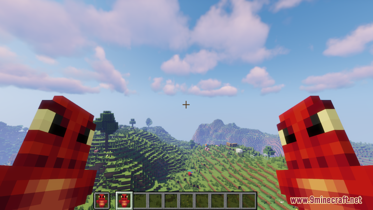 Dragon Totem of Undying Resource Pack Screenshot 7 Player holding fierce red dragon totems while looking at a vast green landscape