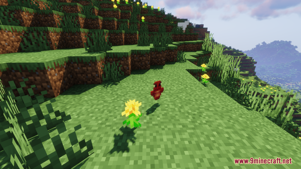 Dragon Totem of Undying Resource Pack Screenshot 8 A red dragon totem item floating on a grassy hill near yellow flowers