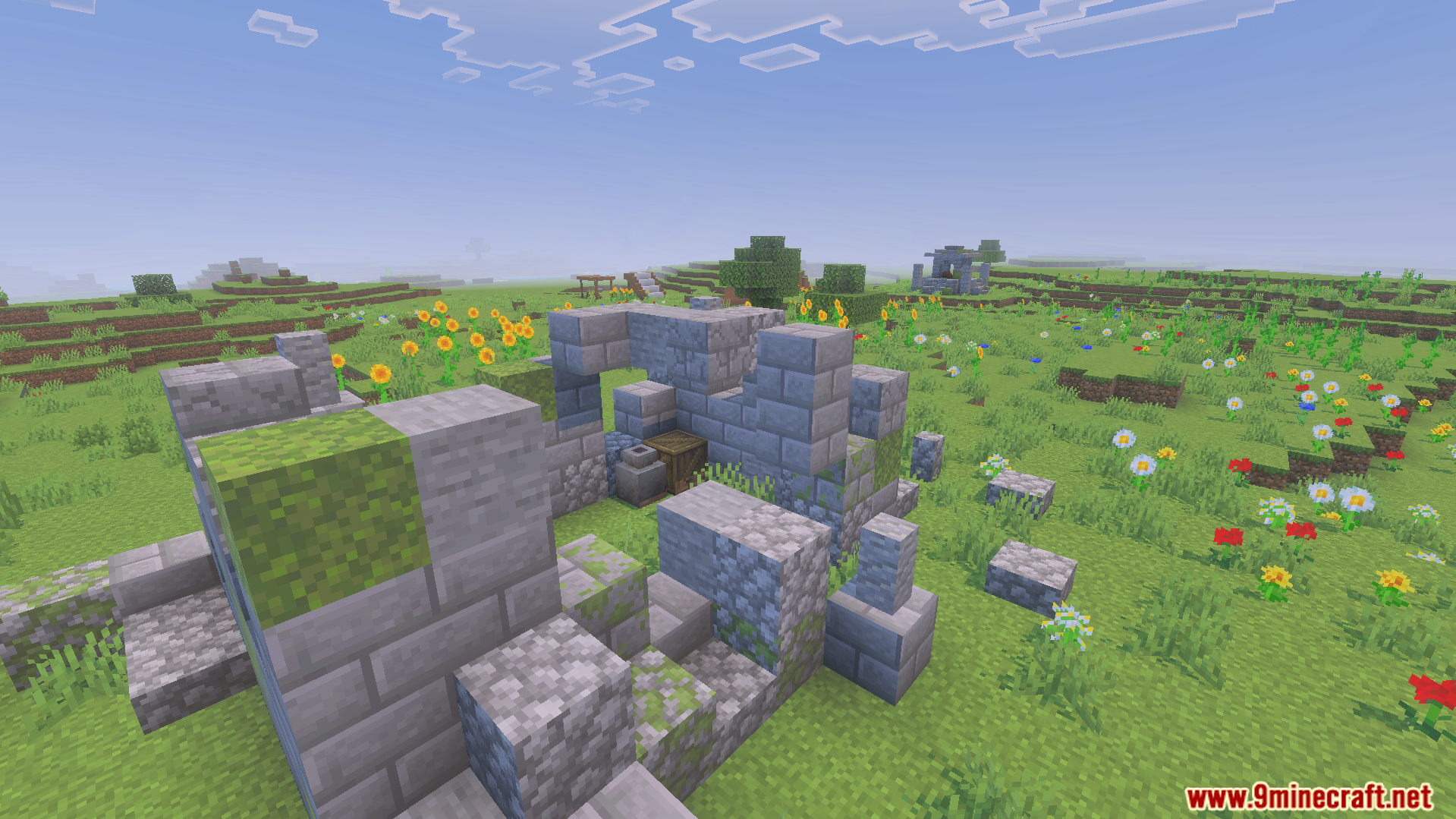 Dungeon Raiders Addon Screenshot 3 Small stone ruin structure found in a grassy field with colorful flowers