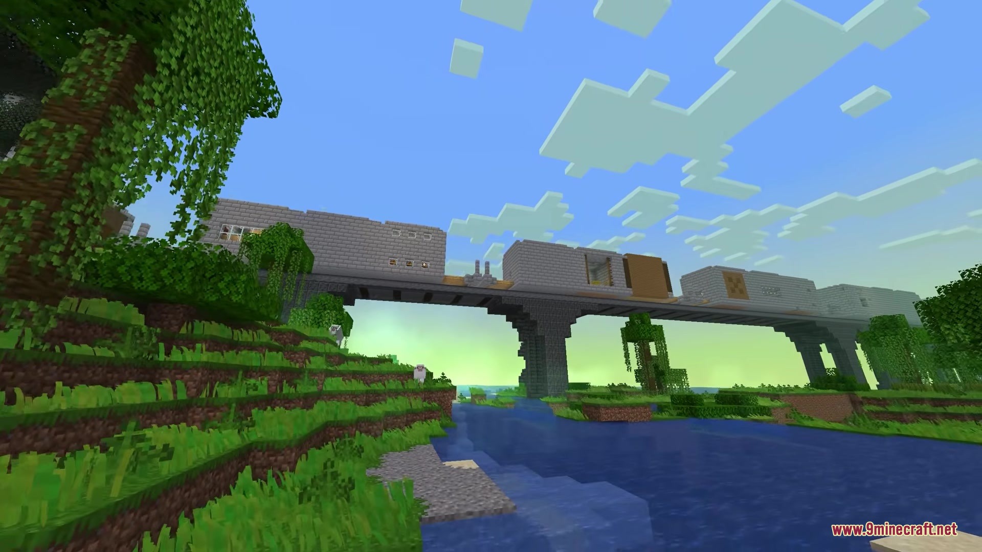 The Dungeon Train moves across a stone bridge over a wide river