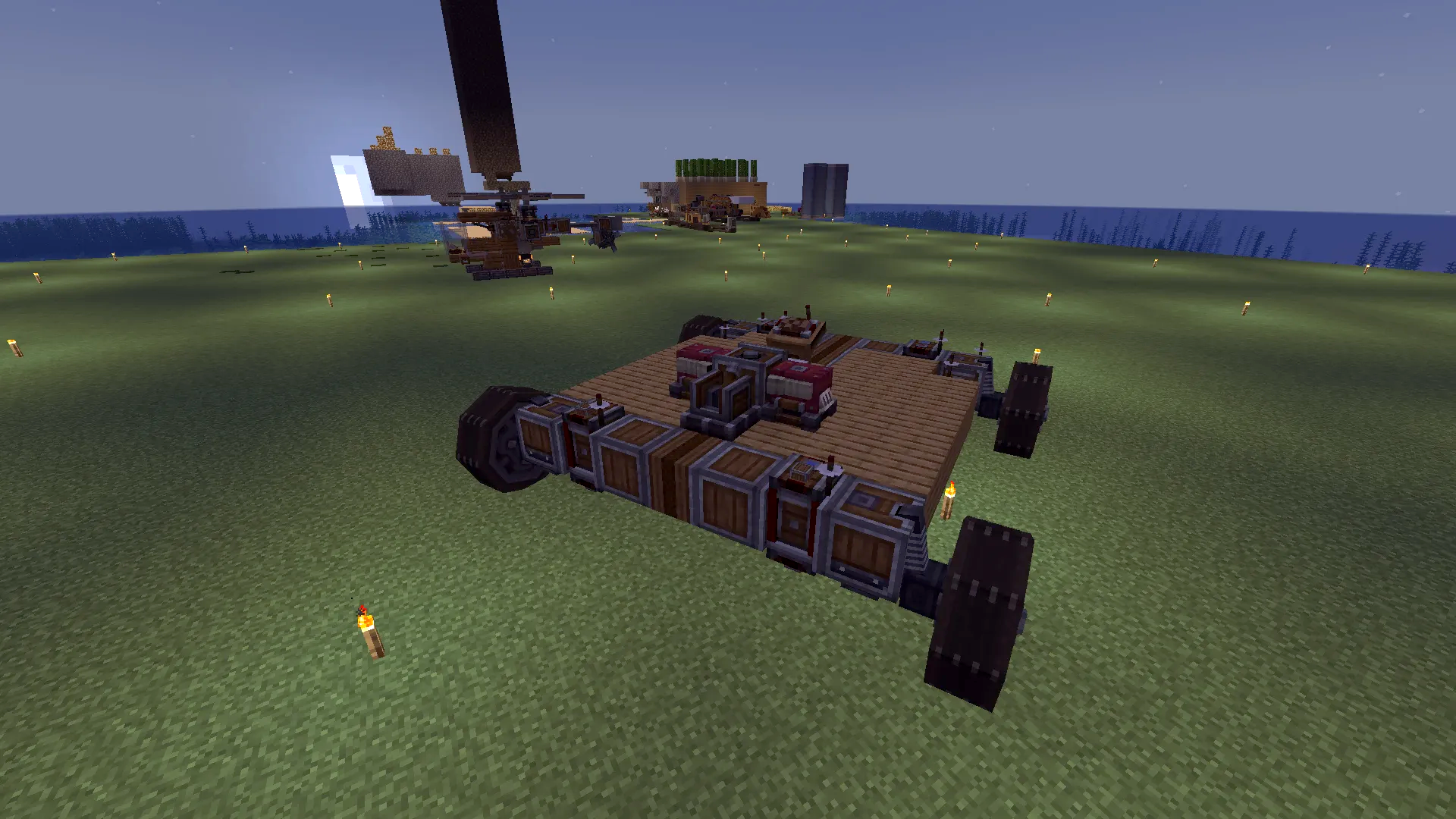 Early Game Car Schematic Screenshots 1 A small wooden vehicle with wheels on a flat grass plain during dusk