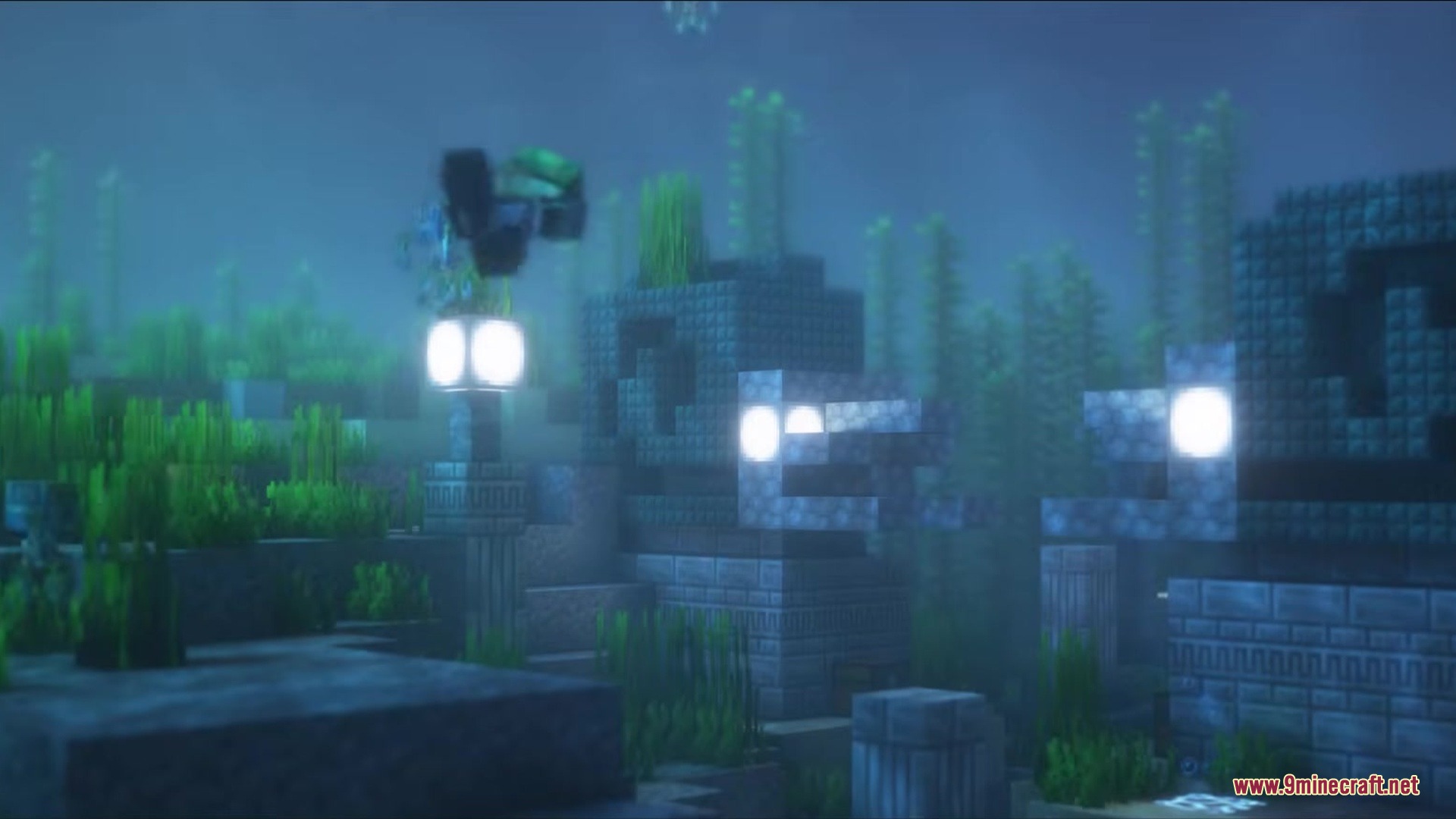 Ancient underwater ruins featuring glowing blocks and lush green seaweed growth