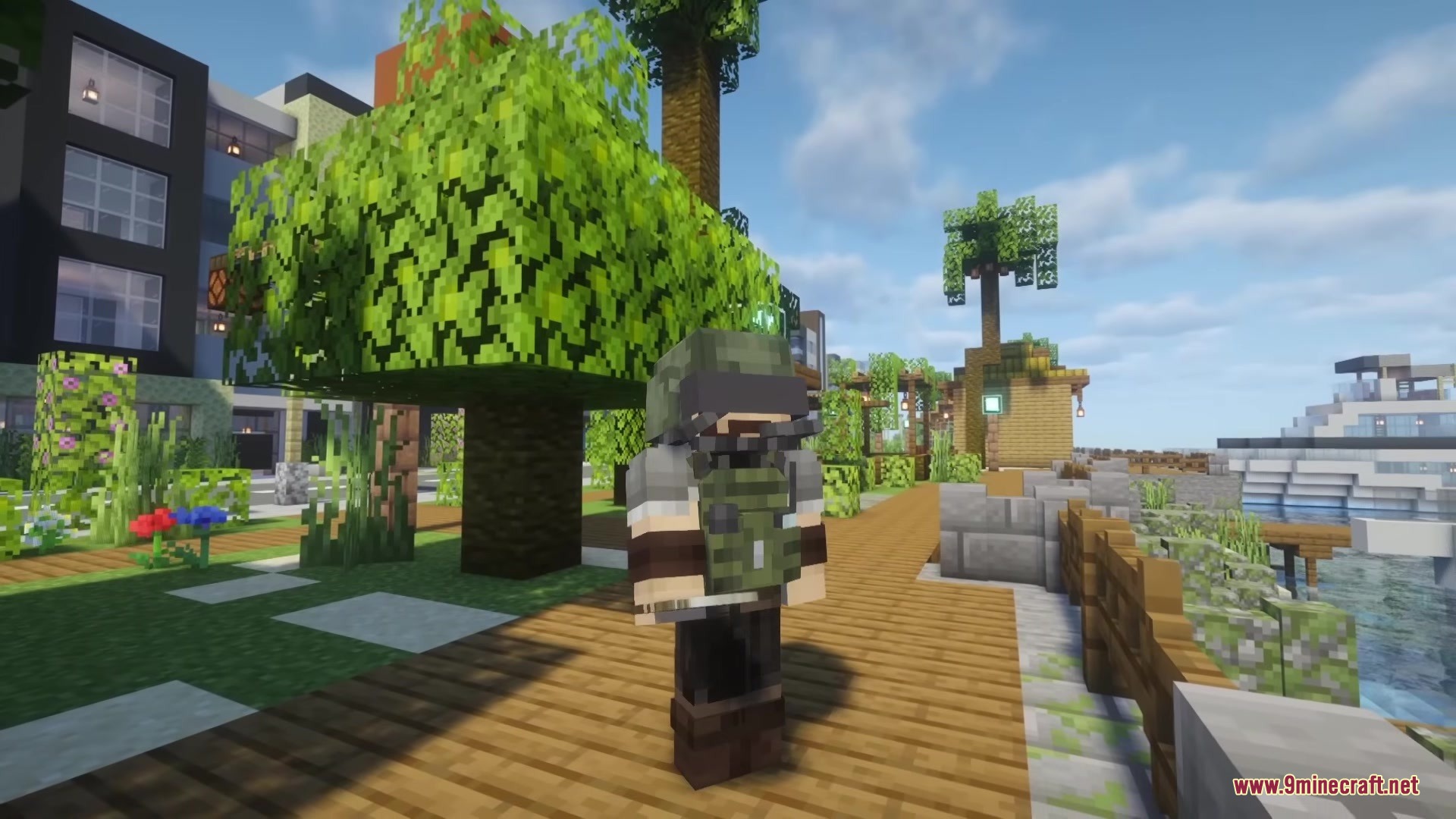 Player wearing green tactical military gear standing on a wooden walkway near the water