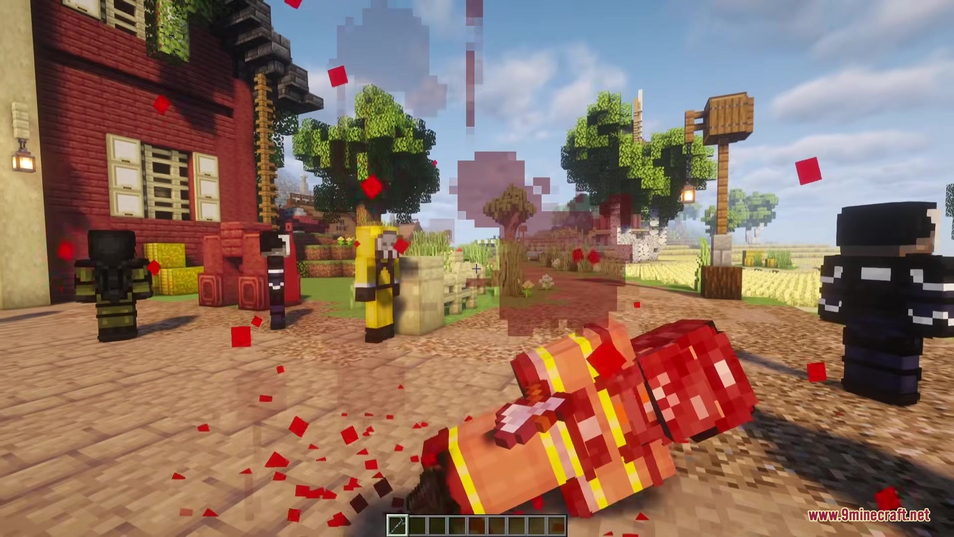 Hazmat and armored zombies stand near a fallen enemy in a village