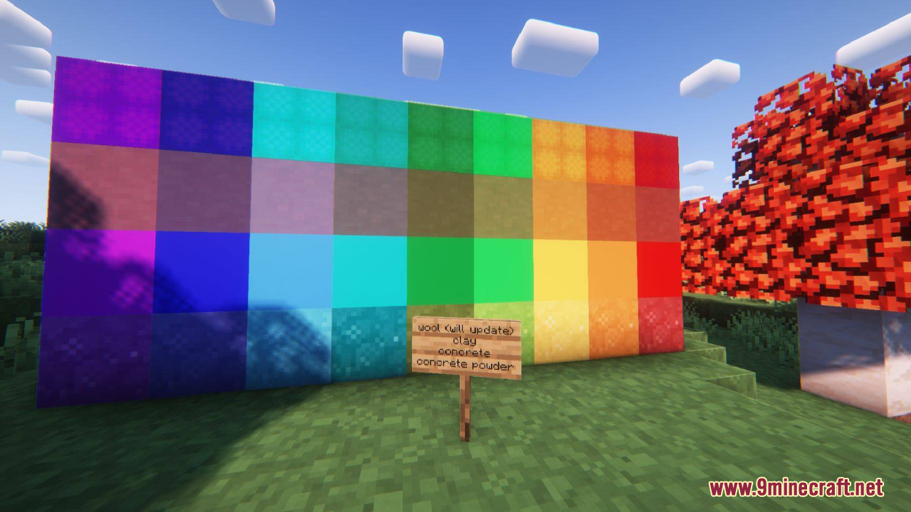 A wall of colorful blocks showcasing different textures with a wooden sign