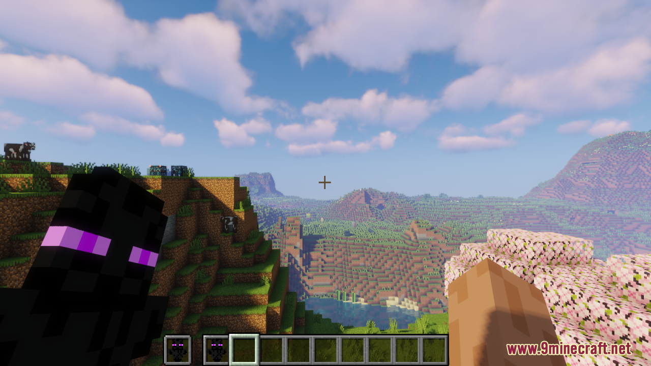 Enderman Totem of Undying Resource Pack Screenshot 3 A player holds a dark Enderman totem while overlooking a scenic mountain landscape