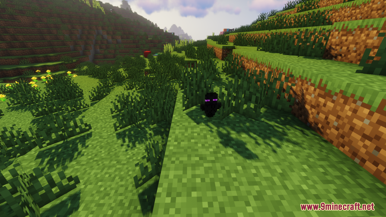 Enderman Totem of Undying Resource Pack Screenshot 5 A small black Enderman totem of undying sits in the green grass