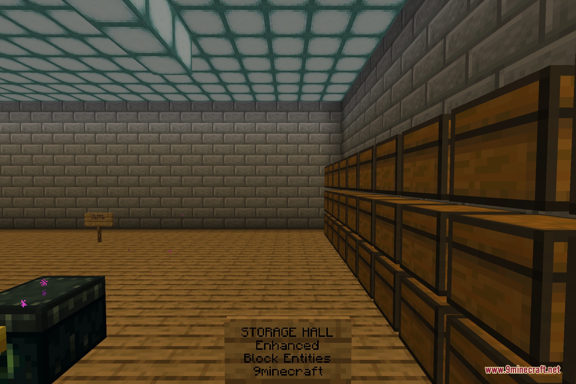 The storage hall marked with a sign reading Enhanced Block Entities, with a long bank of chests on the right and an ender chest on the left