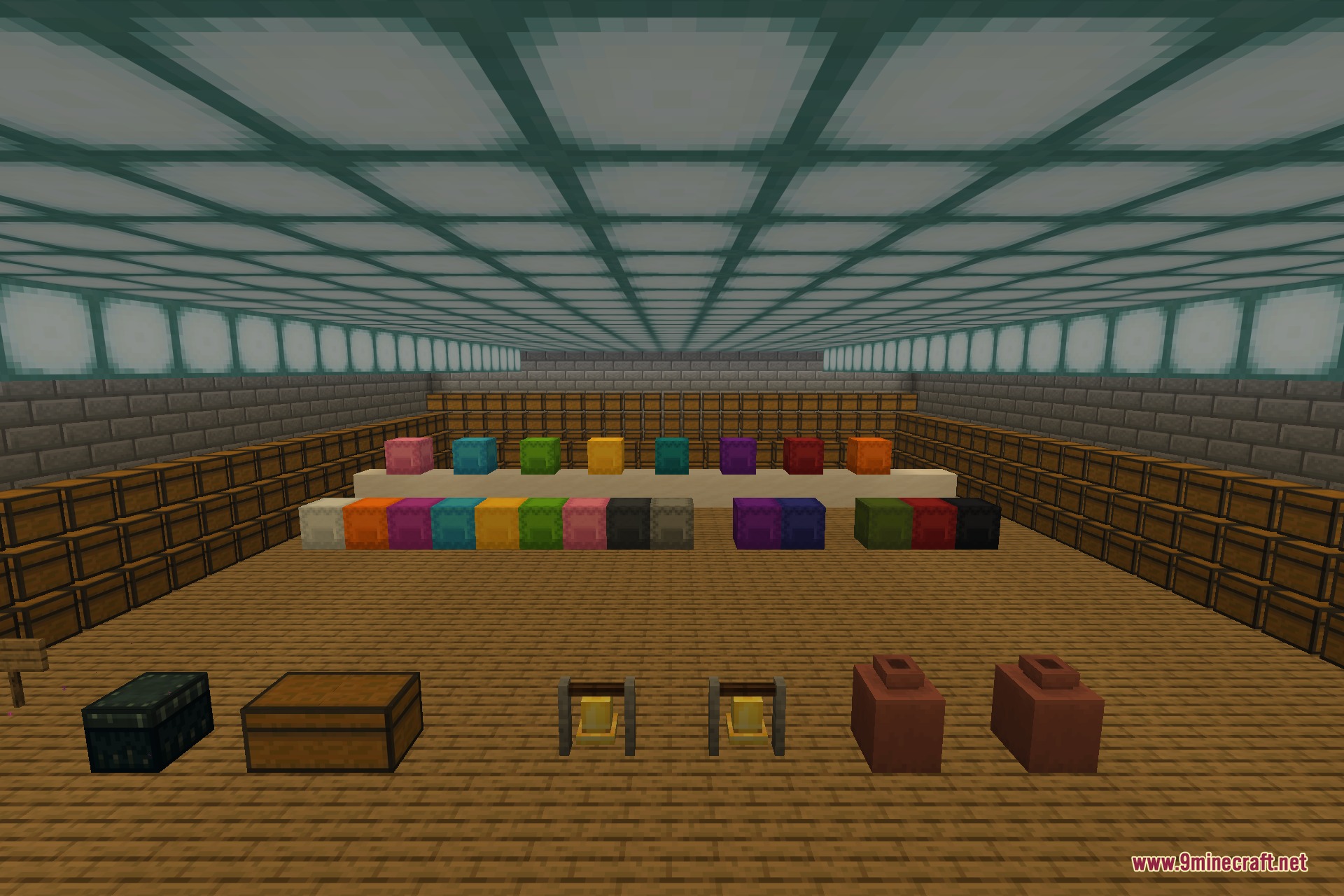 A storage hall lined with barrels and filled with block entities drawn by the mod, including a full row of dyed shulker boxes, an ender chest, a wooden chest, a pair of bells, and decorated pots, all rendering together without slowdown