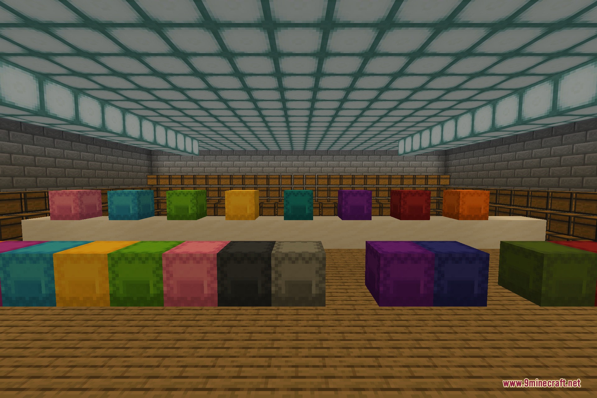 A complete set of shulker boxes in every dye colour lined up on a platform in front of a barrel wall