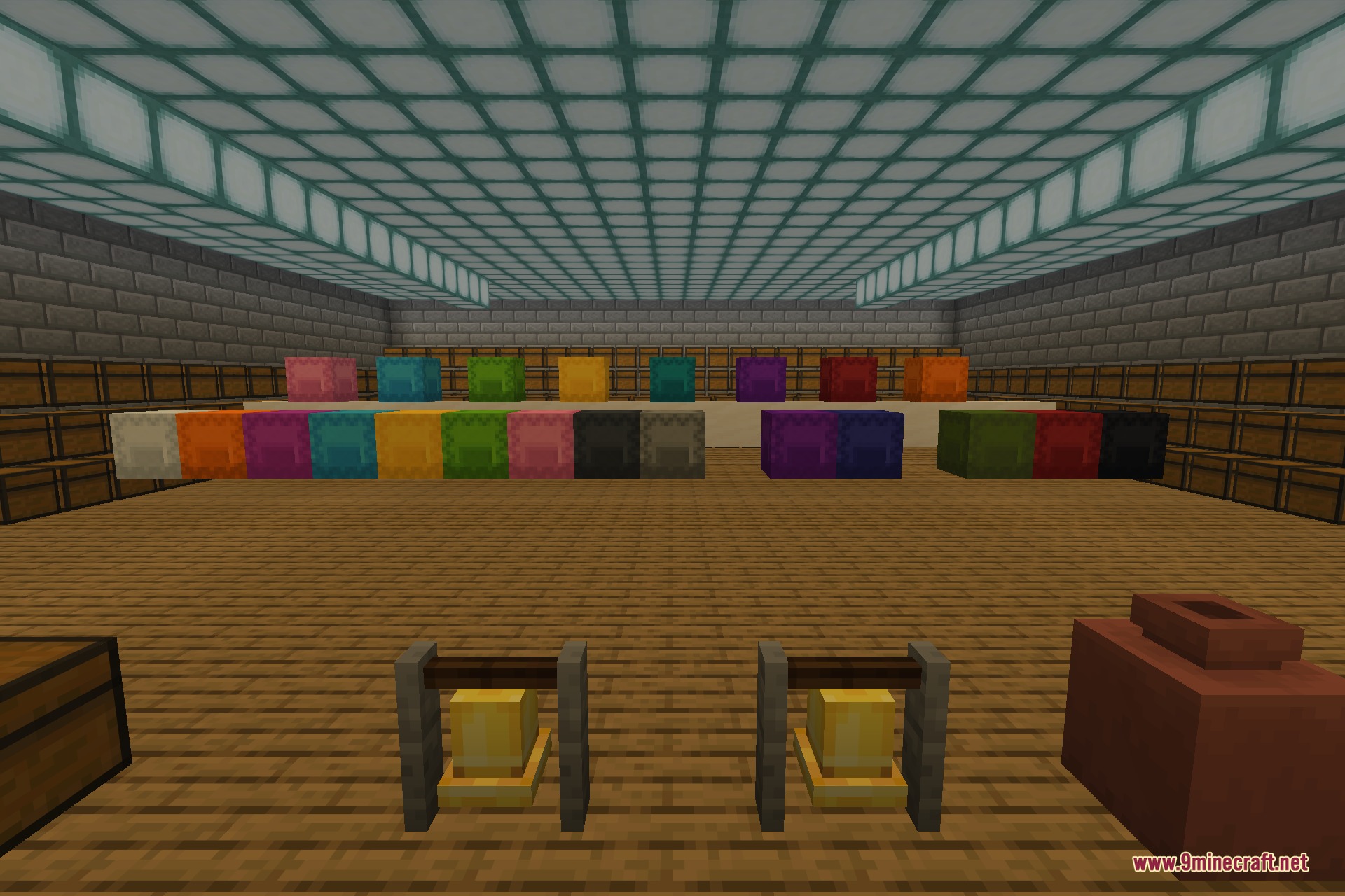 The storage hall seen from ground level, with bells and a decorated pot in the foreground and dyed shulker boxes lined up across the room