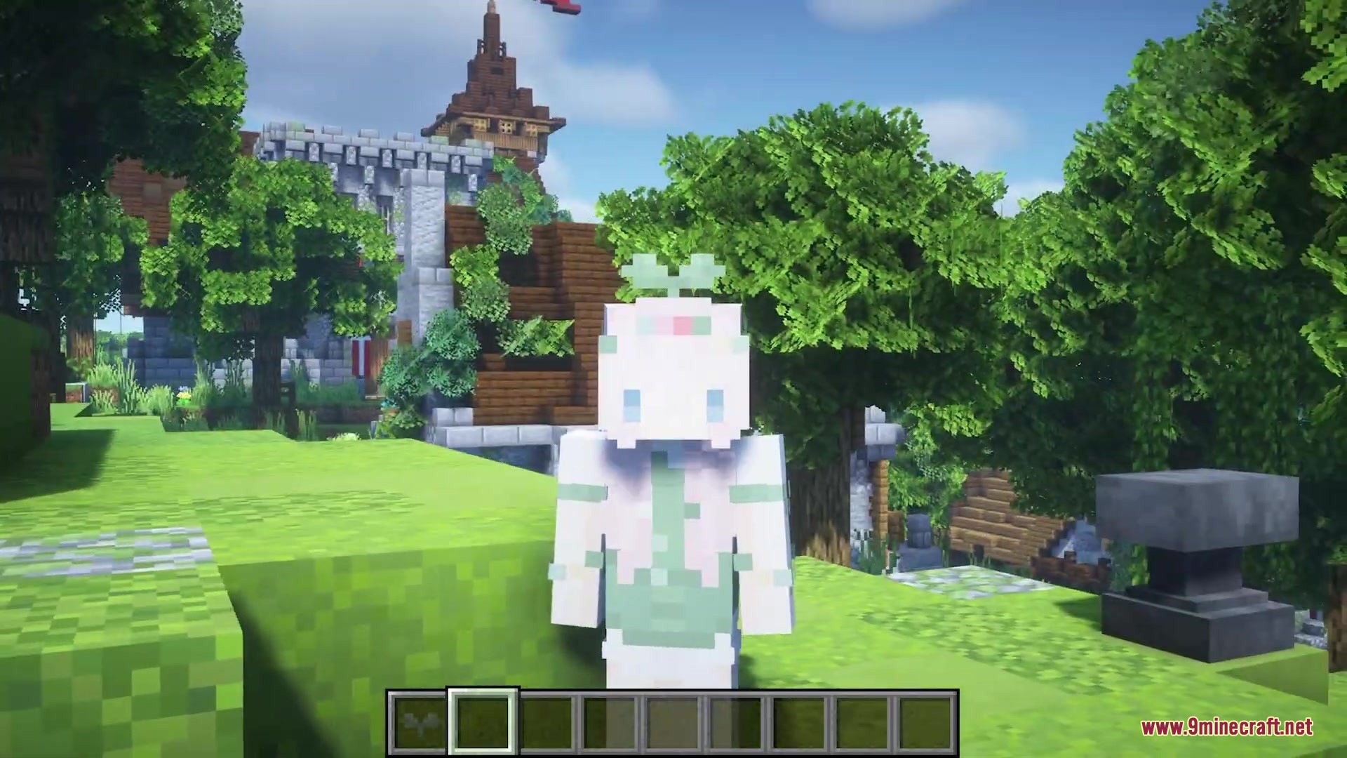 The sprout character stands in a lush forest with a wooden tower behind