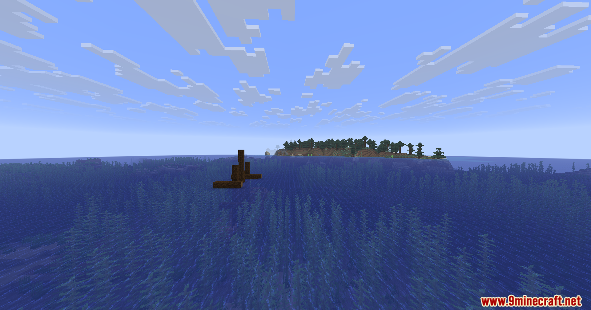Shipwreck mast sticking out of the water near a spruce forest island