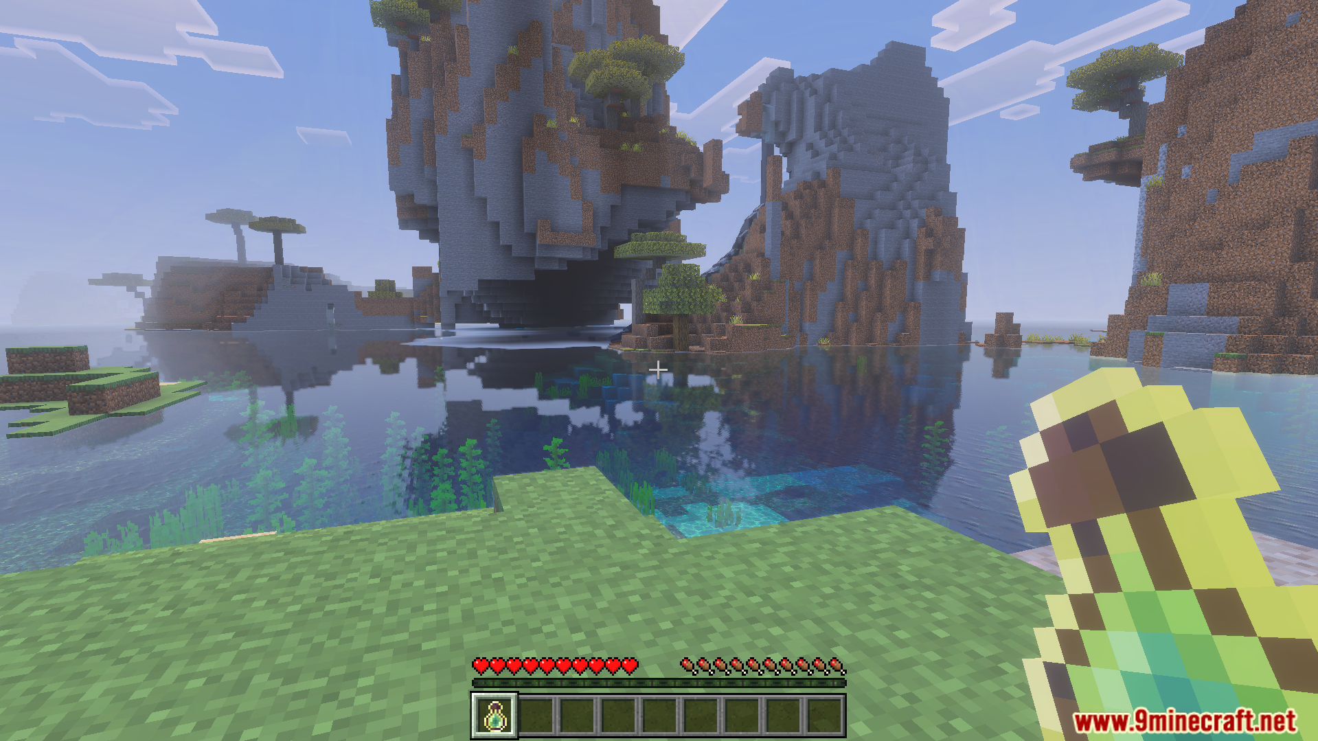 Extra XP Addon Screenshot 3 Player holding a custom experience bottle from the Extra XP Addon near mountains