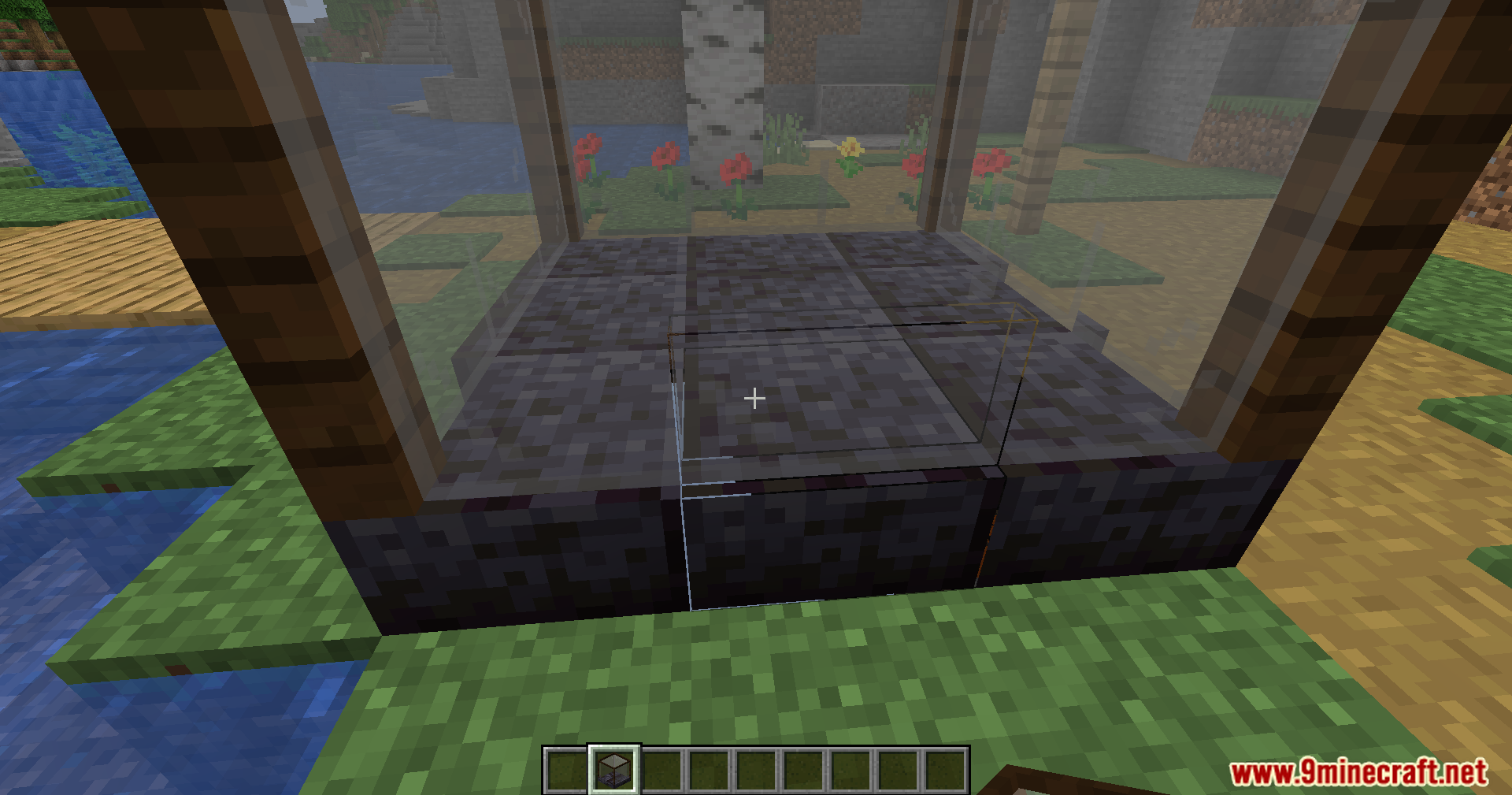 Close up view of the Unearther machine base with glass and stone