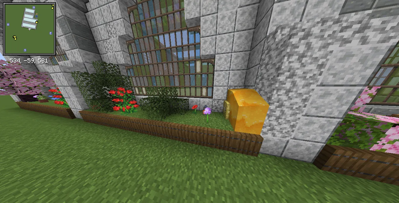 Factory Adg Schematic Screenshots 6 Honey block and garden flowers placed along the base of a stone wall