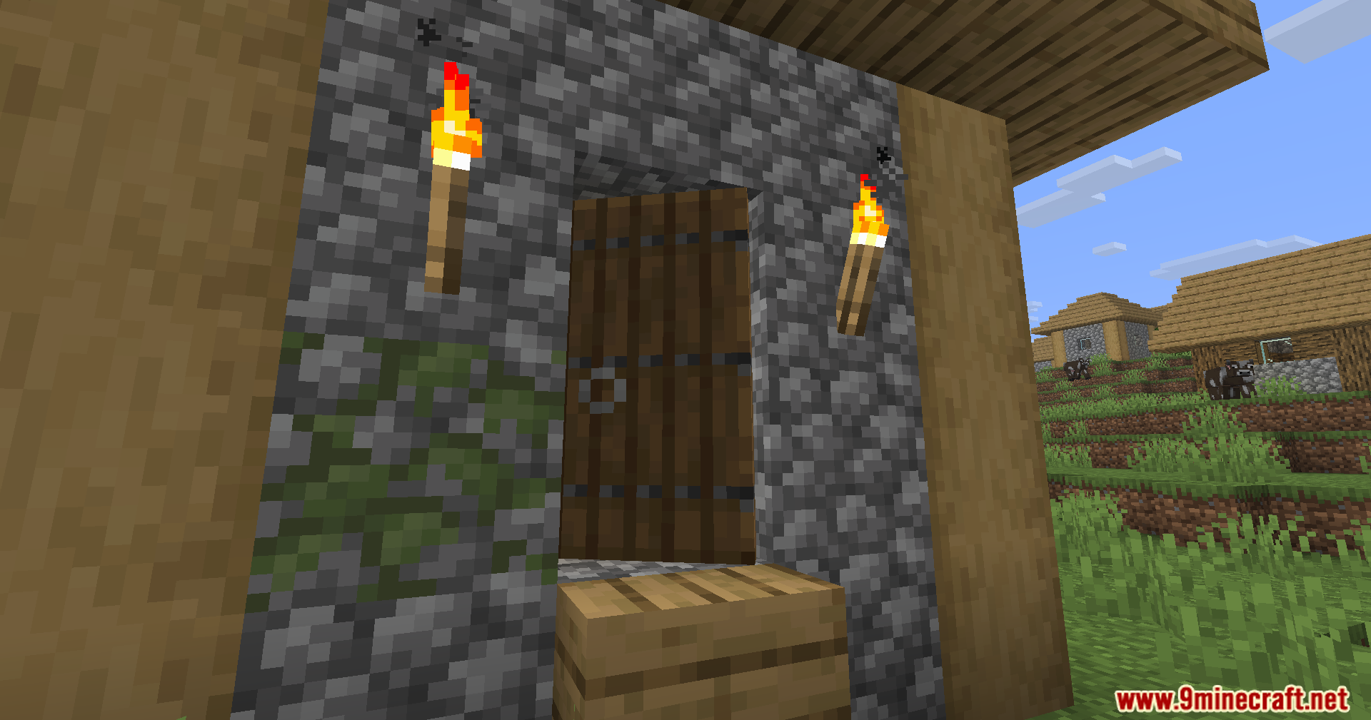 Fancy Door Animations Mod Screenshot 7 A dark oak door swinging open in a mossy cobblestone house entrance