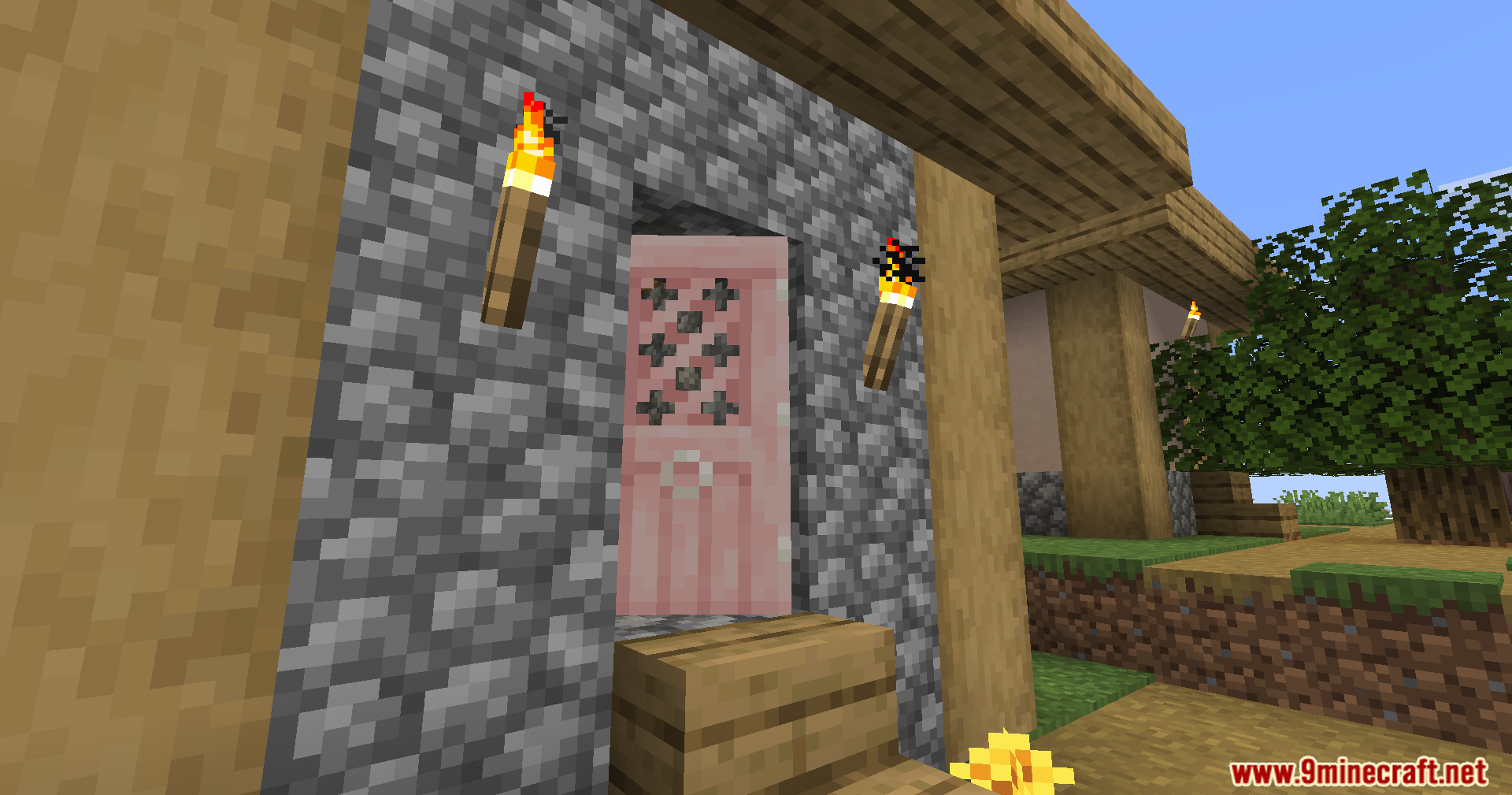 Fancy Door Animations Mod Screenshot 9 A closed pink cherry wood door set into a cobblestone house wall