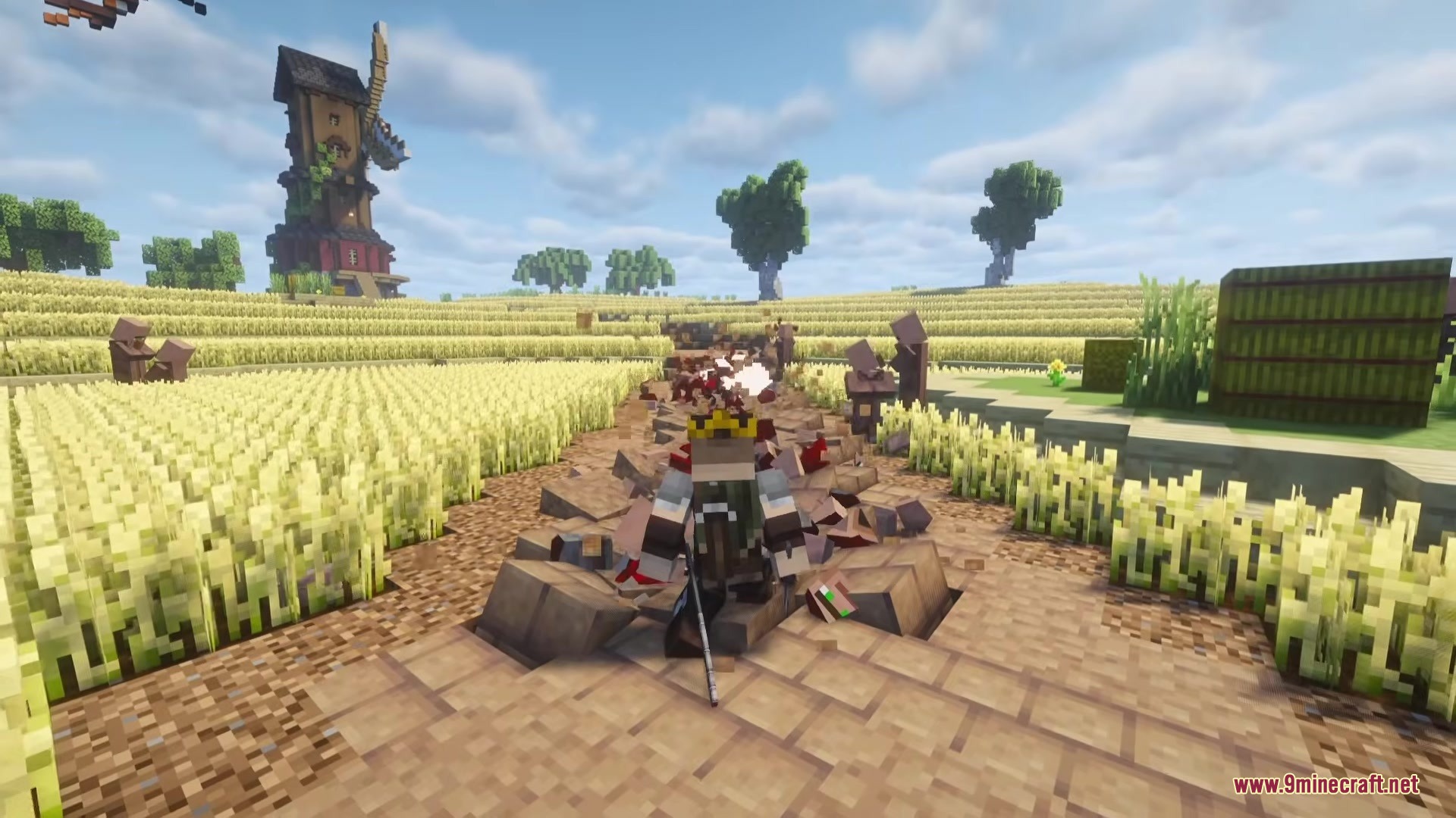 A crowned player stands on a path littered with red debris near a windmill