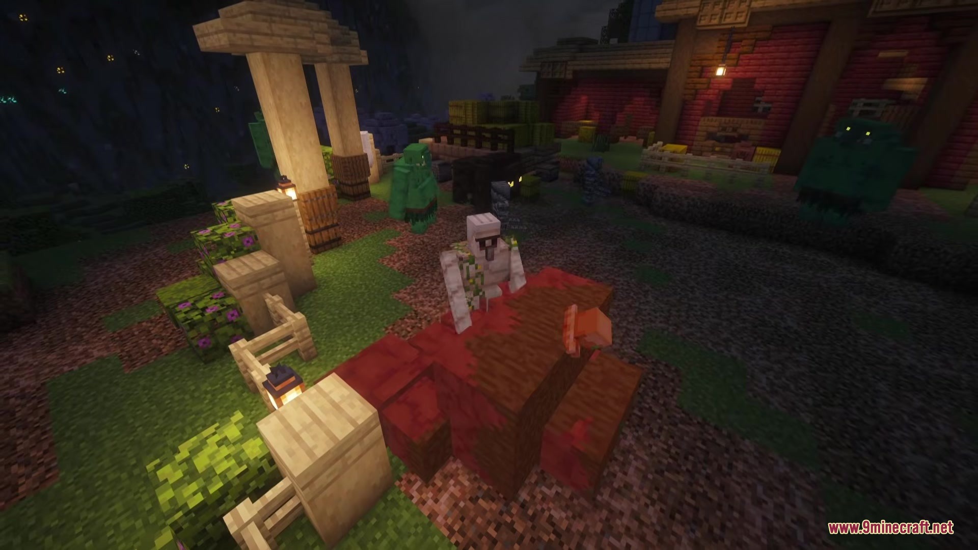 An Iron Golem stands near a red block while green goblins roam nearby