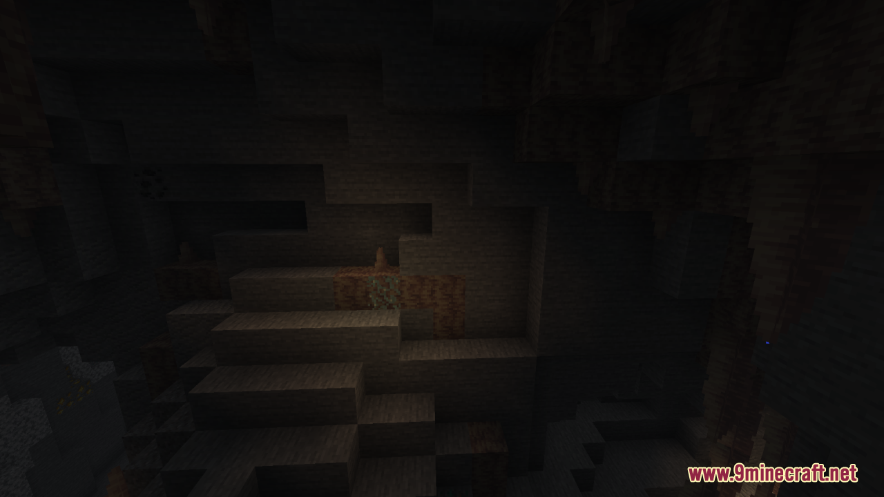 Dark cave walls with stone and dirt blocks in low light conditions