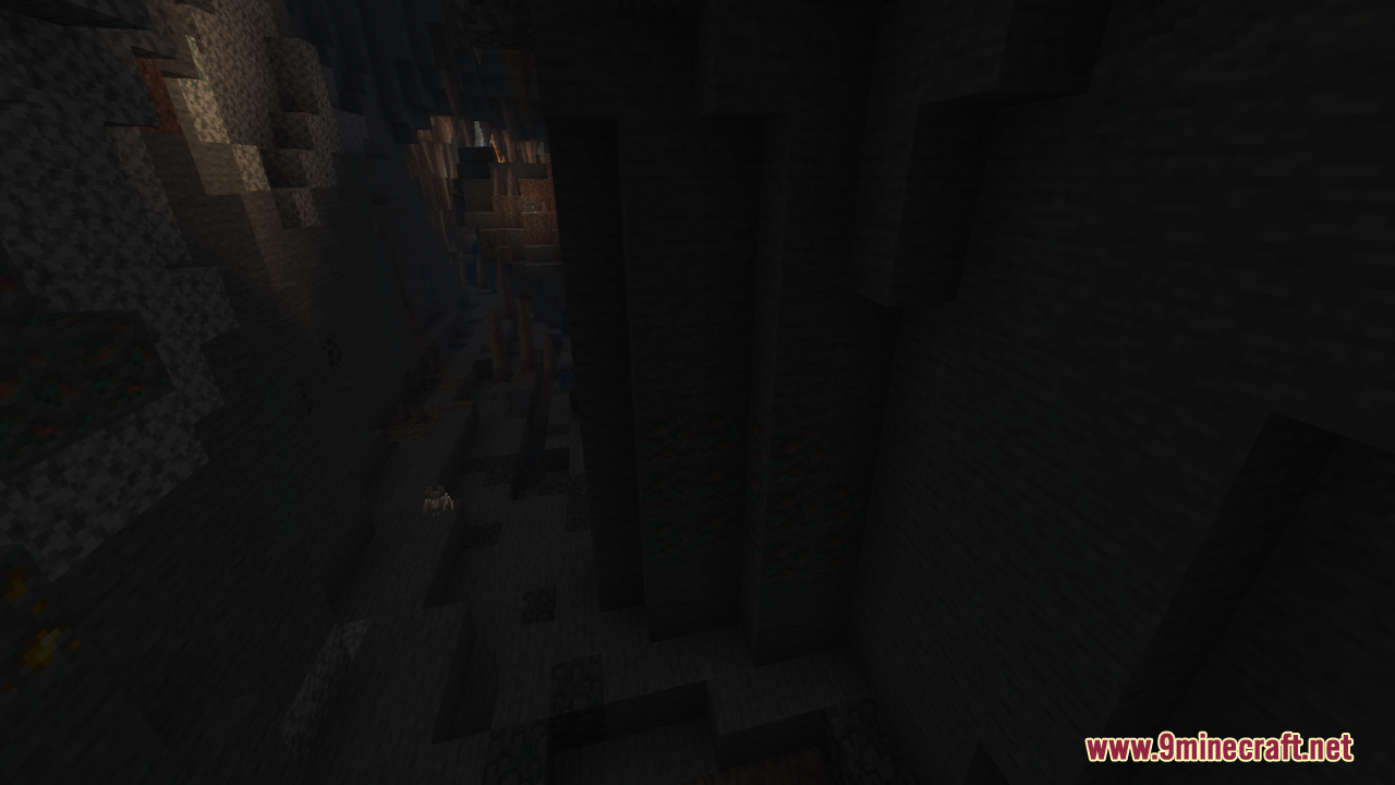 A dark and deep underground ravine with steep stone walls