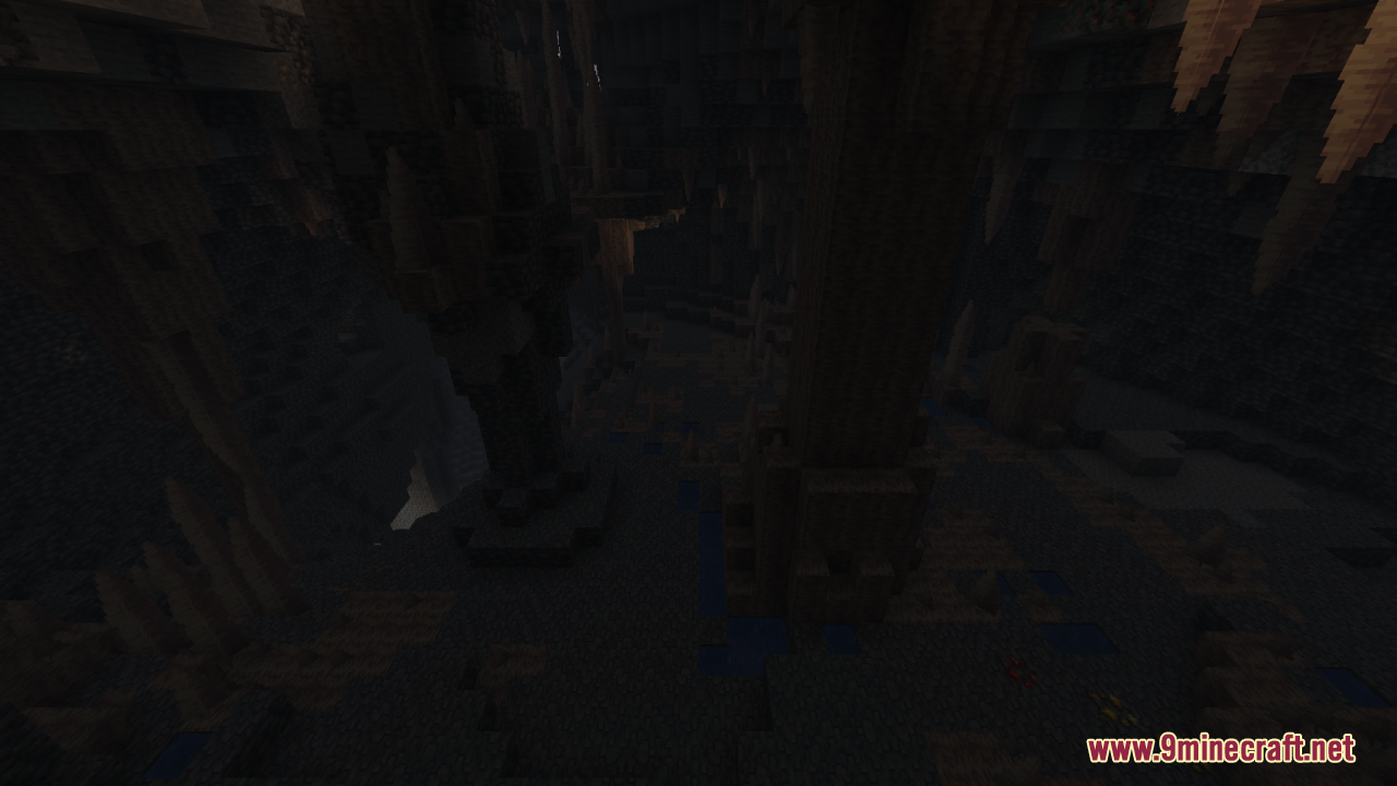Dark underground cavern in Minecraft featuring sharp stalactites and rocky terrain
