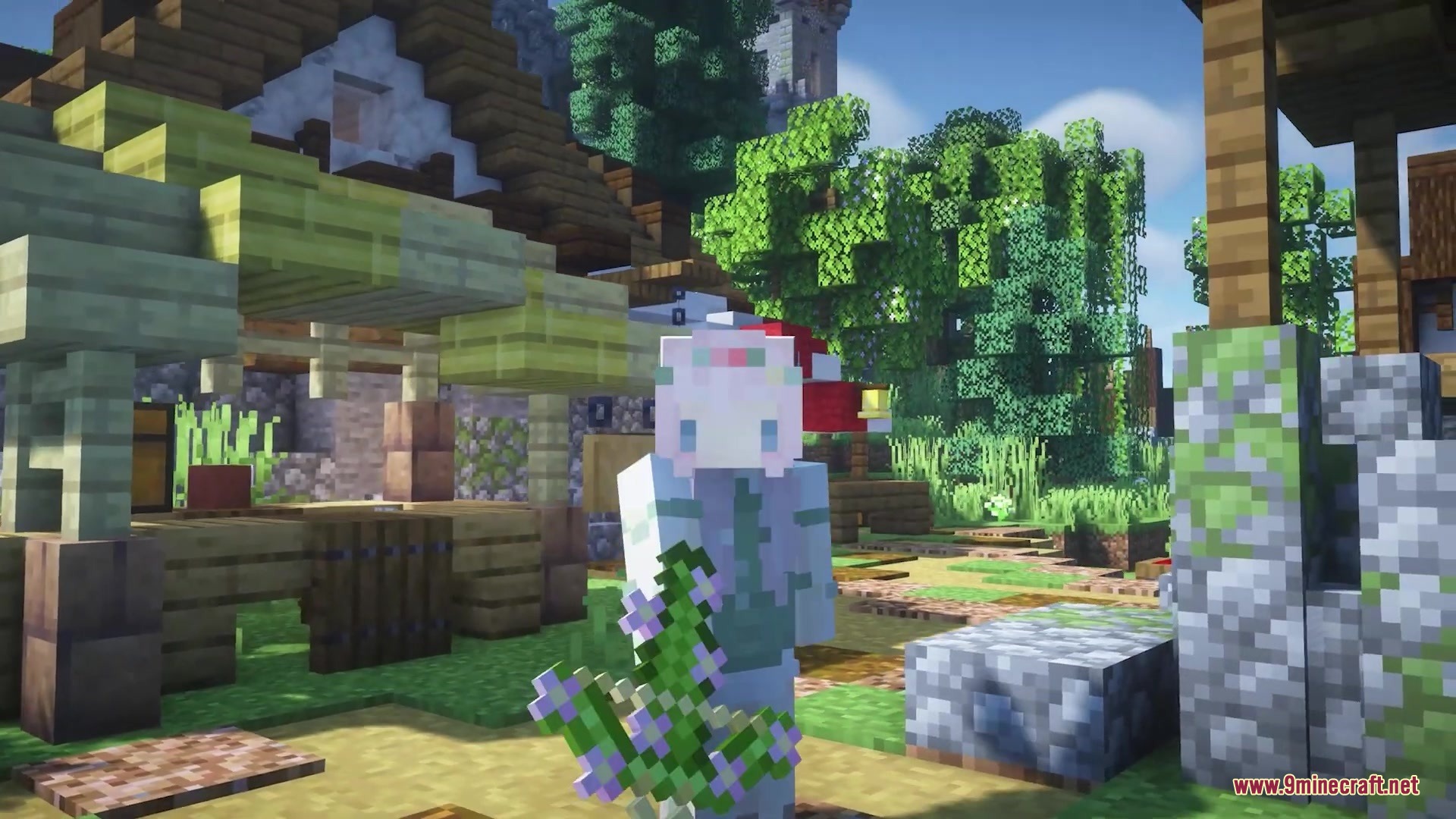 A Minecraft player holding a block of oak leaves with pink flowers