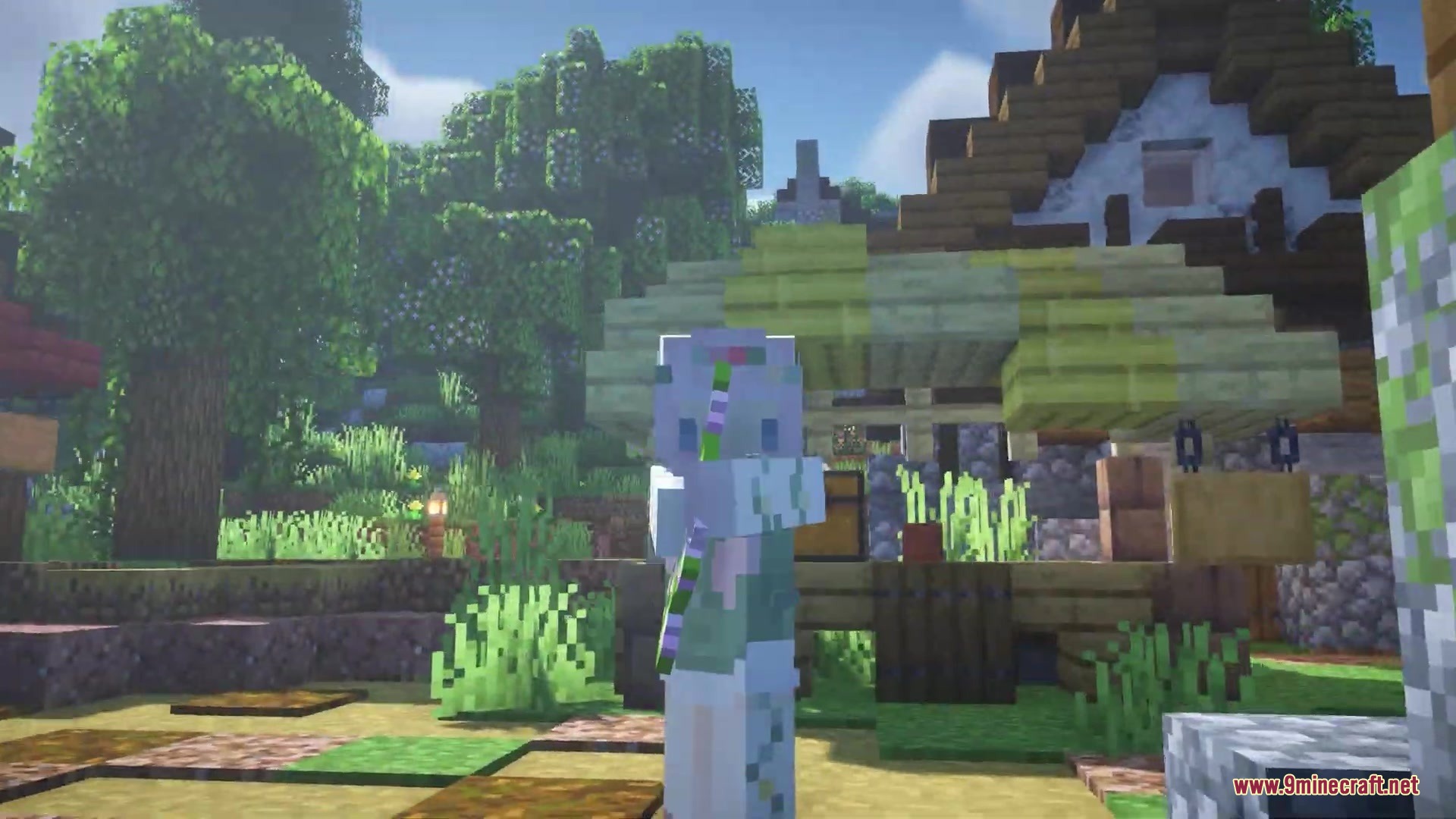A Minecraft character stands in a village with trees showing small colorful blossoms
