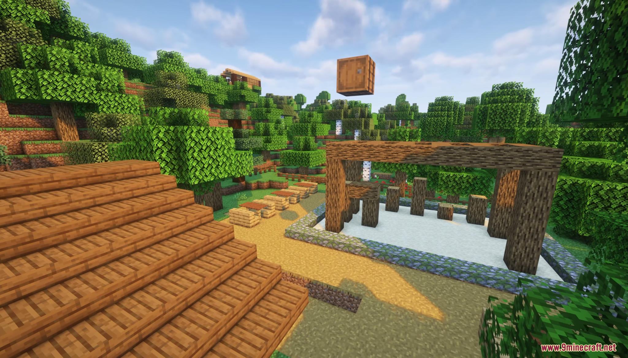 A wooden training structure and a dirt path in a forest village