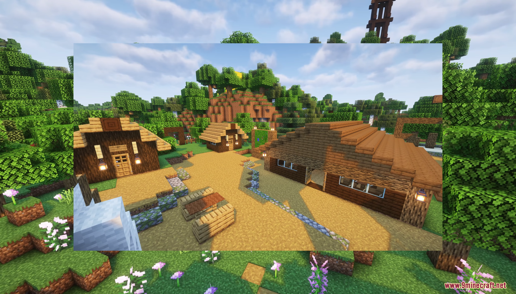 A peaceful village with wooden houses and a tall watchtower in the background
