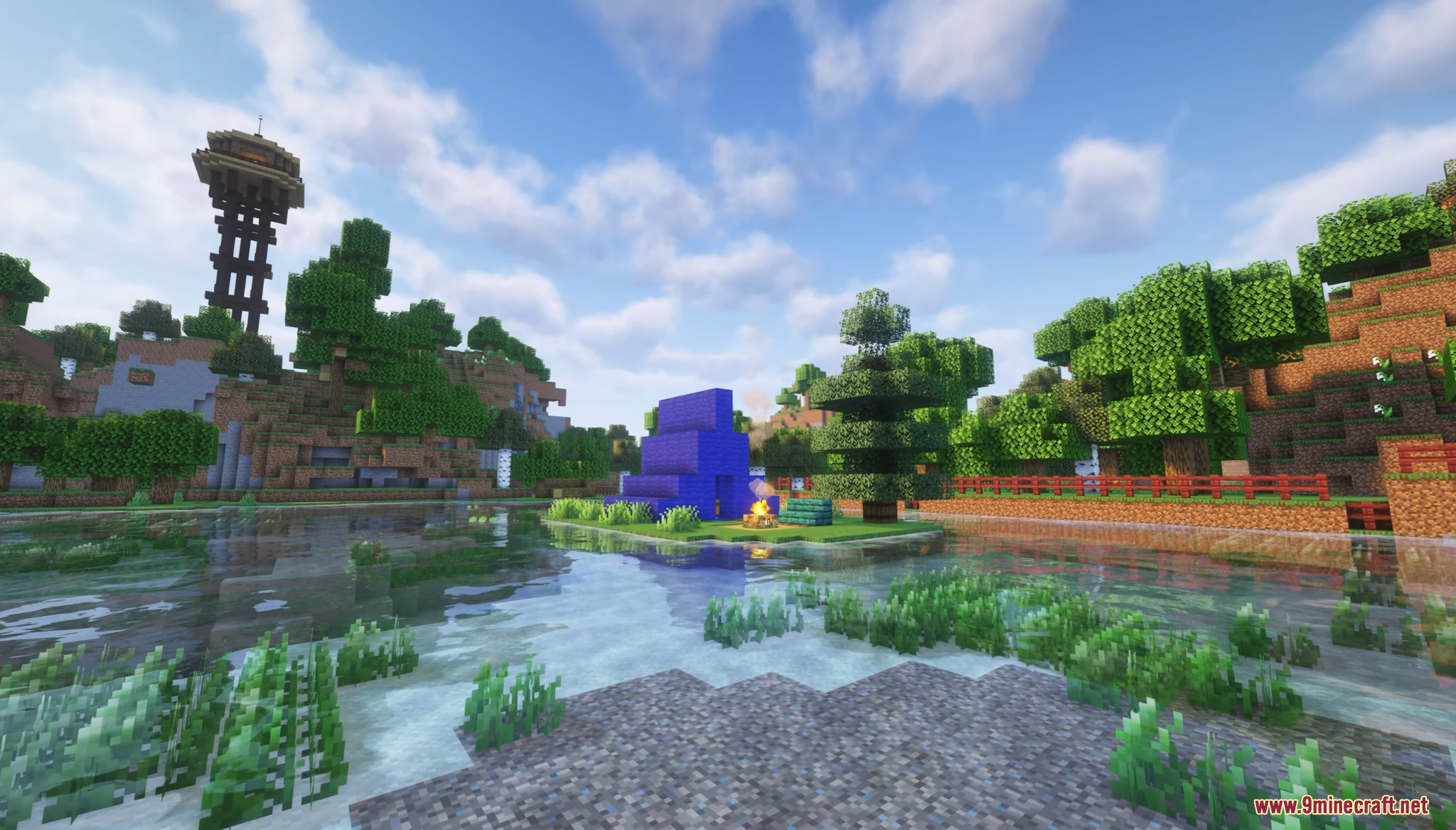 A blue tent and campfire sit on a small island in the water