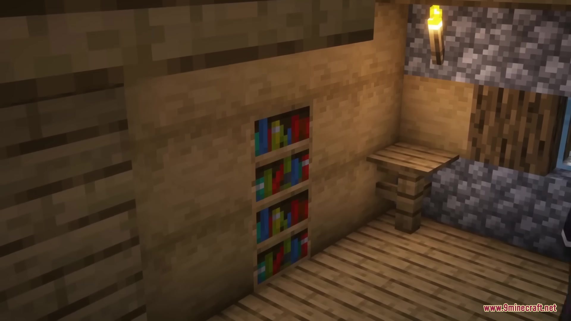 A cozy room featuring a built in bookshelf and a wooden table